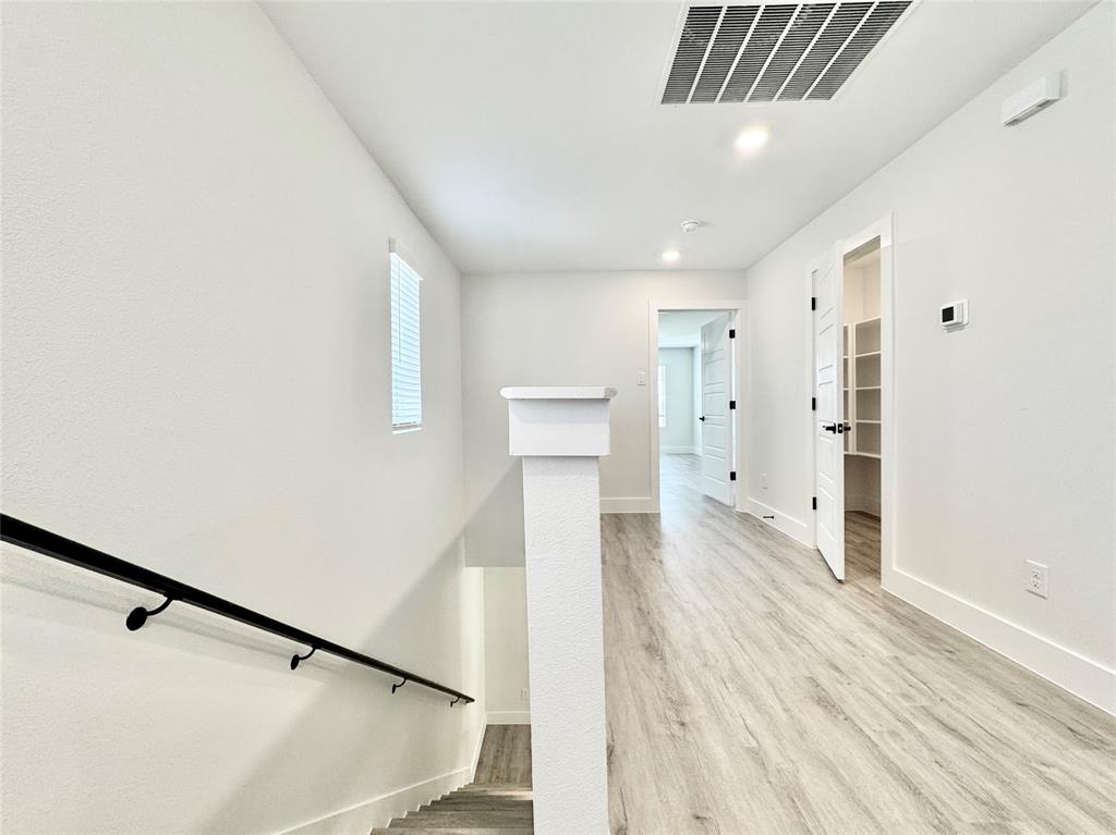 8749 Scotty's Lk Lane The Colony, TX 75056 - Photo 15 of 33 Stairs with baseboards, wood finished floors, and recessed lighting