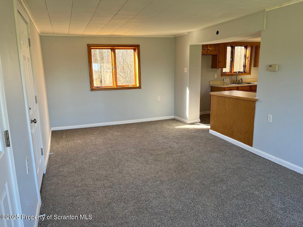 3191 Aberdeen Road Moscow, PA 18444 - Photo 6 of 14 an empty room with windows and refrigerator