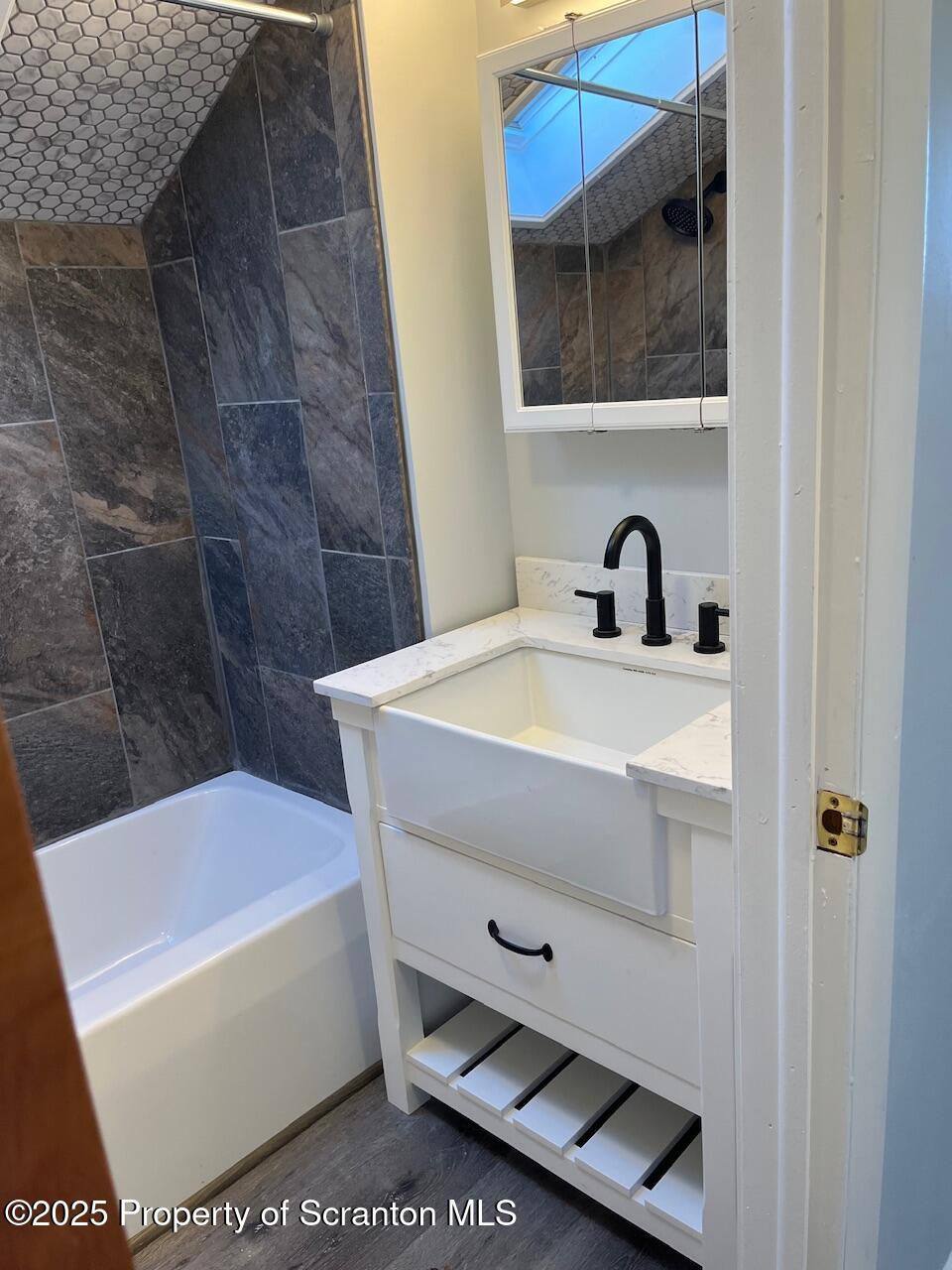 3191 Aberdeen Road Moscow, PA 18444 - Photo 10 of 14 a bathroom with a sink a mirror and tub