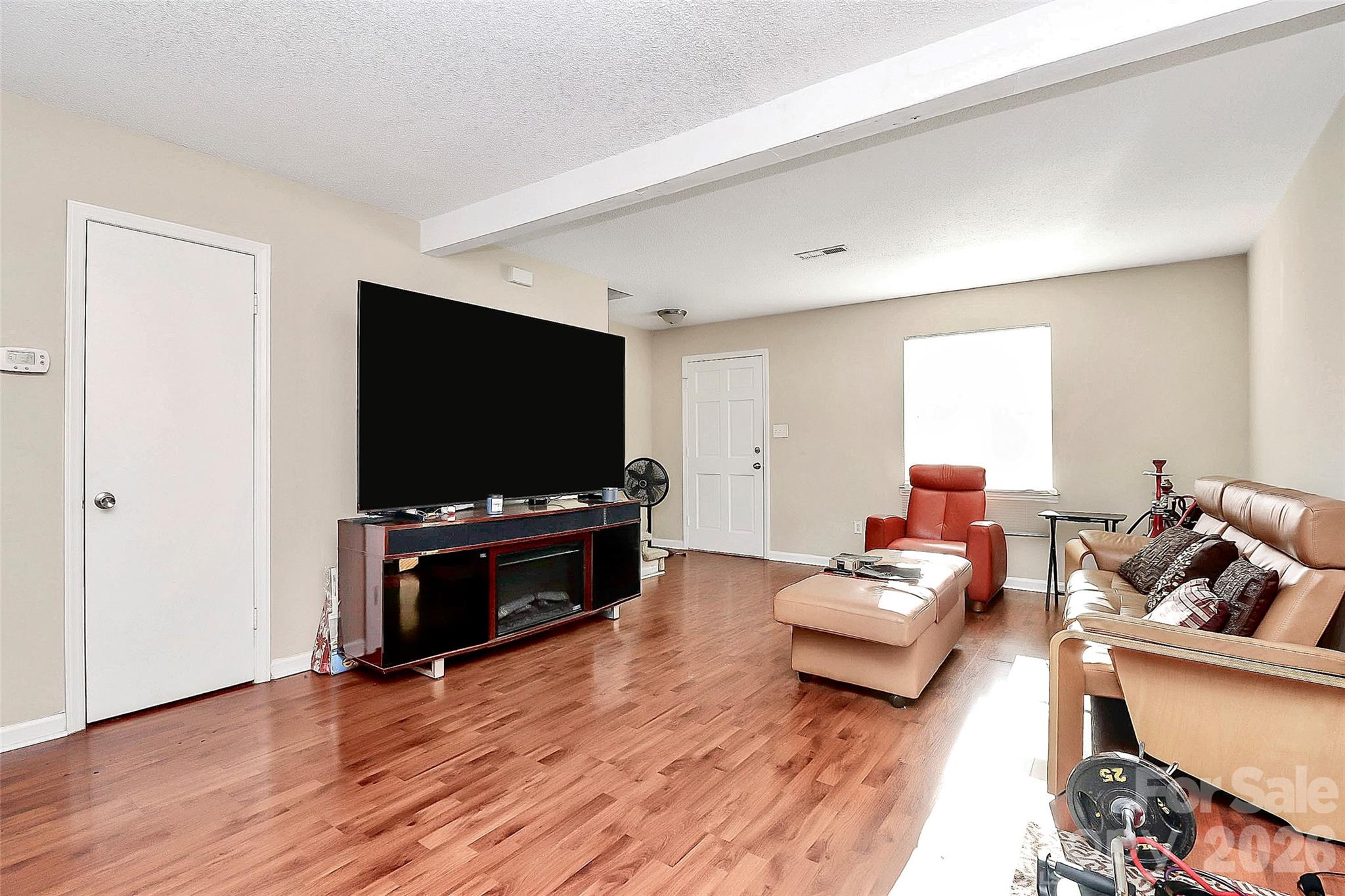 11115 Park Road Charlotte, NC 28226 - Photo 11 of 21 a living room with furniture and a flat screen tv