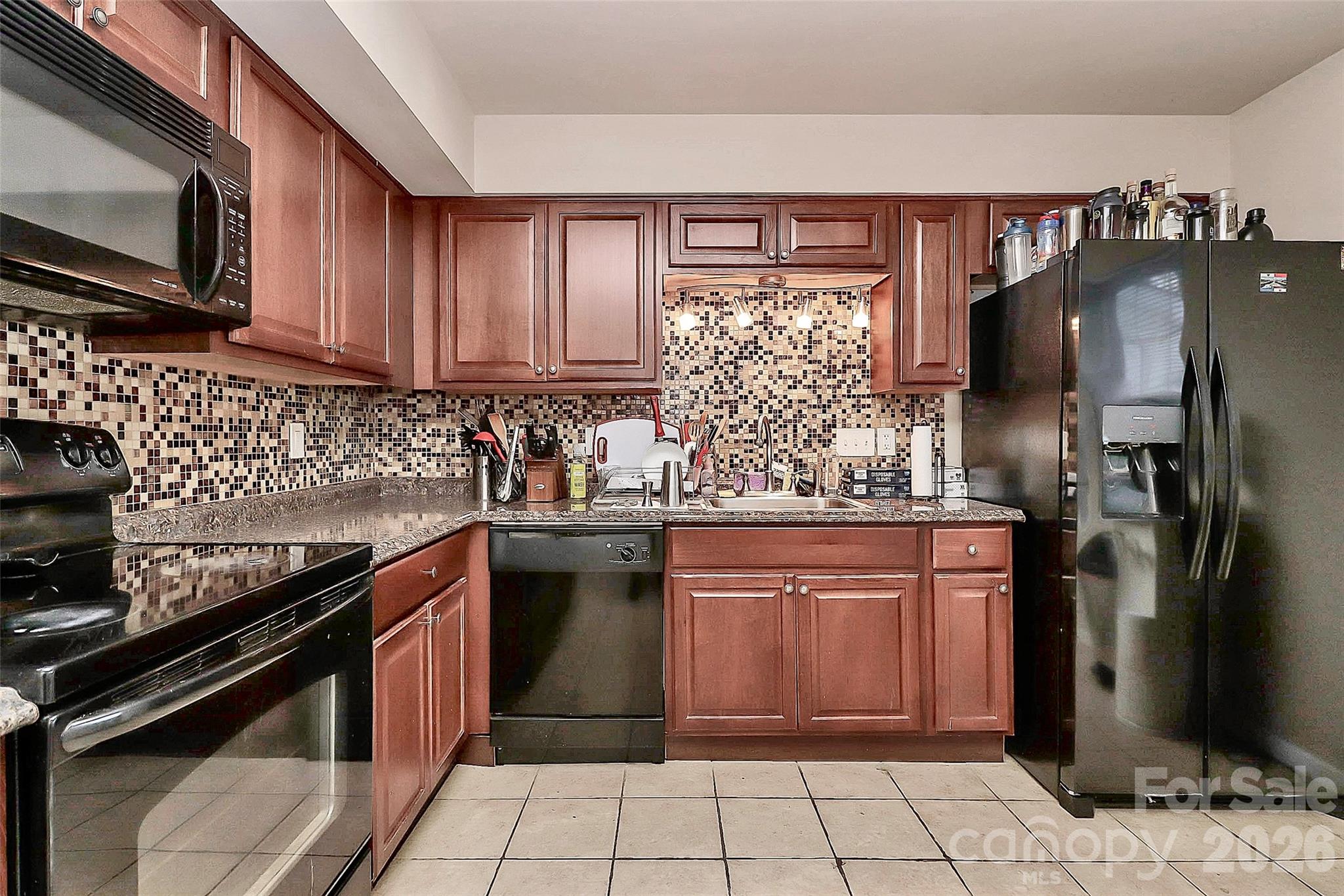 11115 Park Road Charlotte, NC 28226 - Photo 18 of 21 a kitchen with stainless steel appliances granite countertop a sink stove and refrigerator