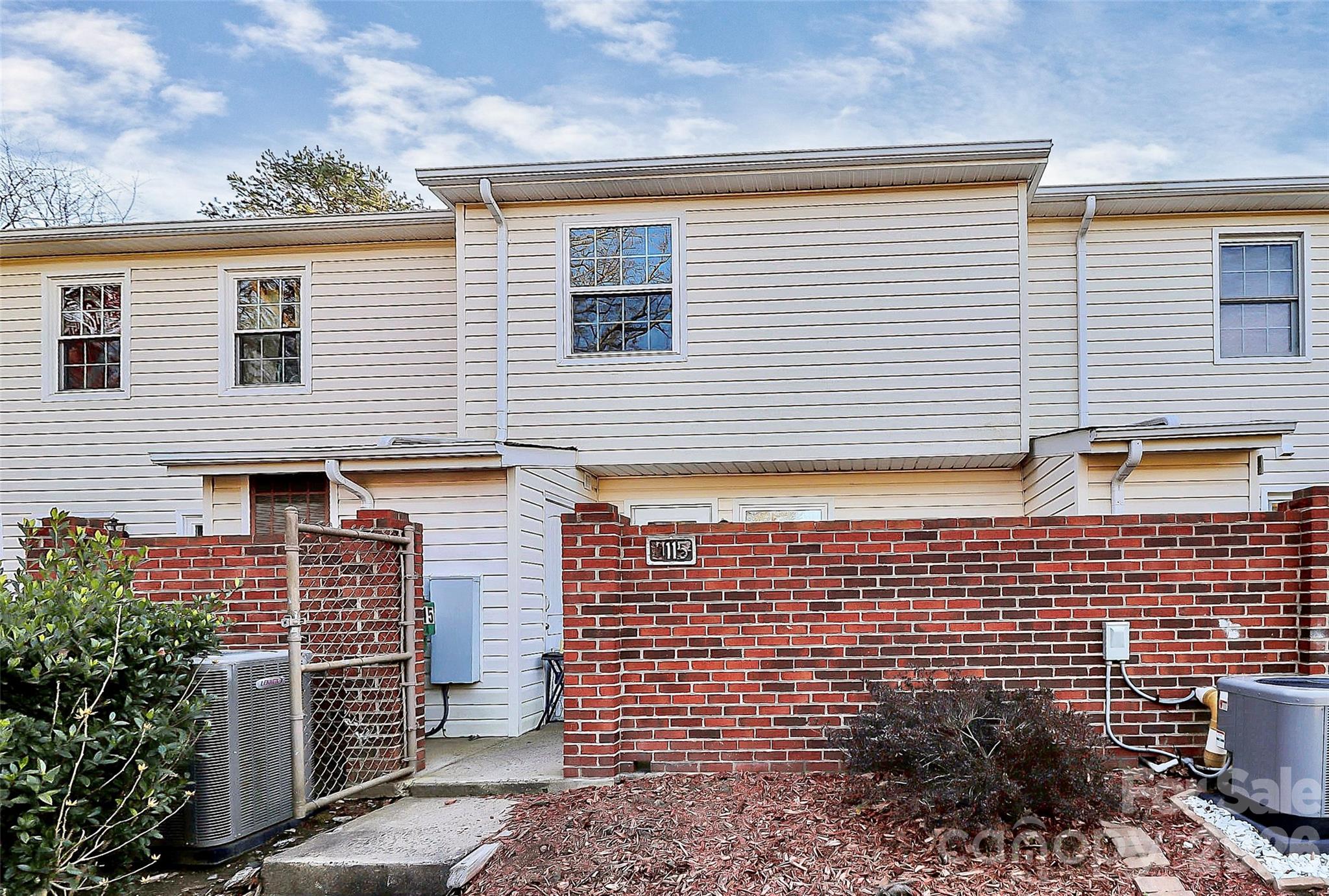 11115 Park Road Charlotte, NC 28226 - Photo 5 of 21 a view of brick buildings with potted plants