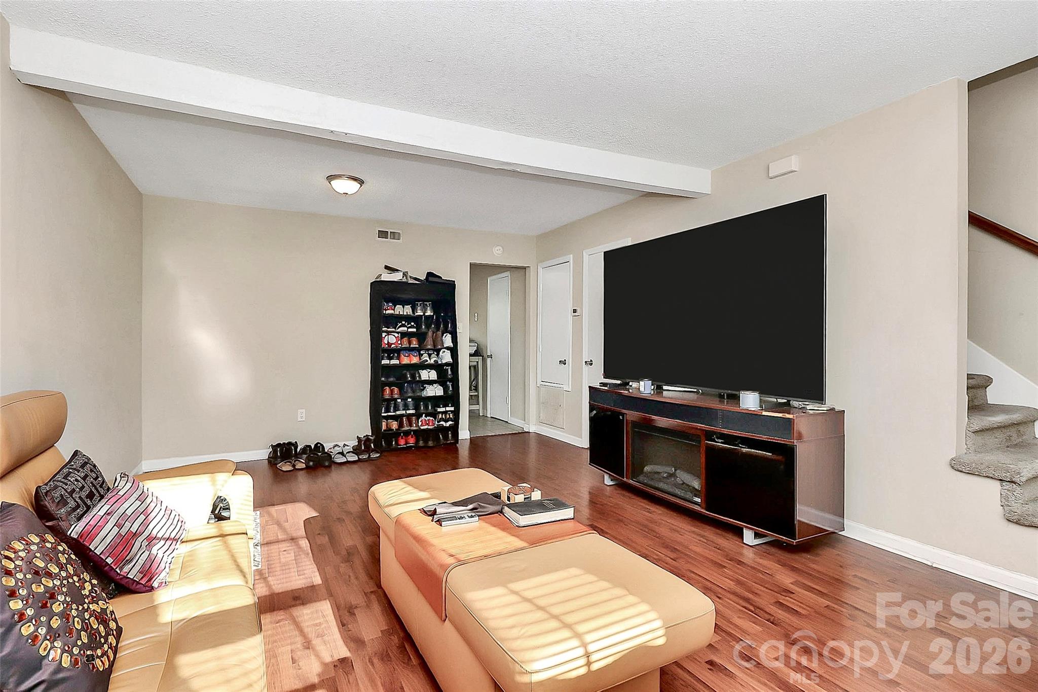 11115 Park Road Charlotte, NC 28226 - Photo 10 of 21 a living room with furniture and a flat screen tv
