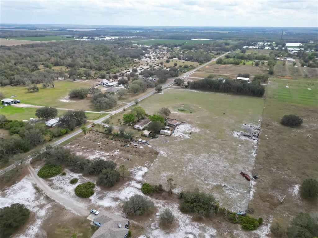 17273 Alderman Turner Road Wimauma, FL 33598 - Photo 13 of 60 an aerial view of residential houses with outdoor space