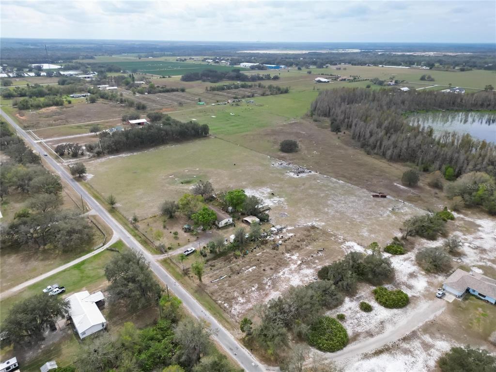 17273 Alderman Turner Road Wimauma, FL 33598 - Photo 15 of 60 a view of a lake with a city