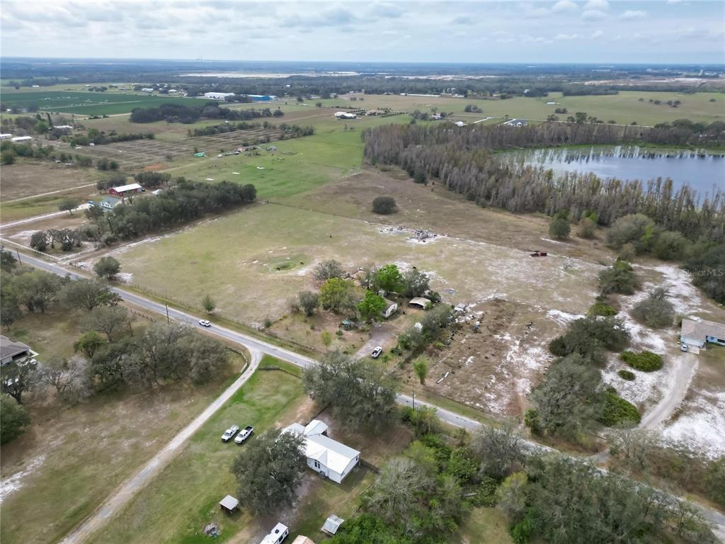 17273 Alderman Turner Road Wimauma, FL 33598 - Photo 16 of 60 an aerial view of a houses with outdoor space
