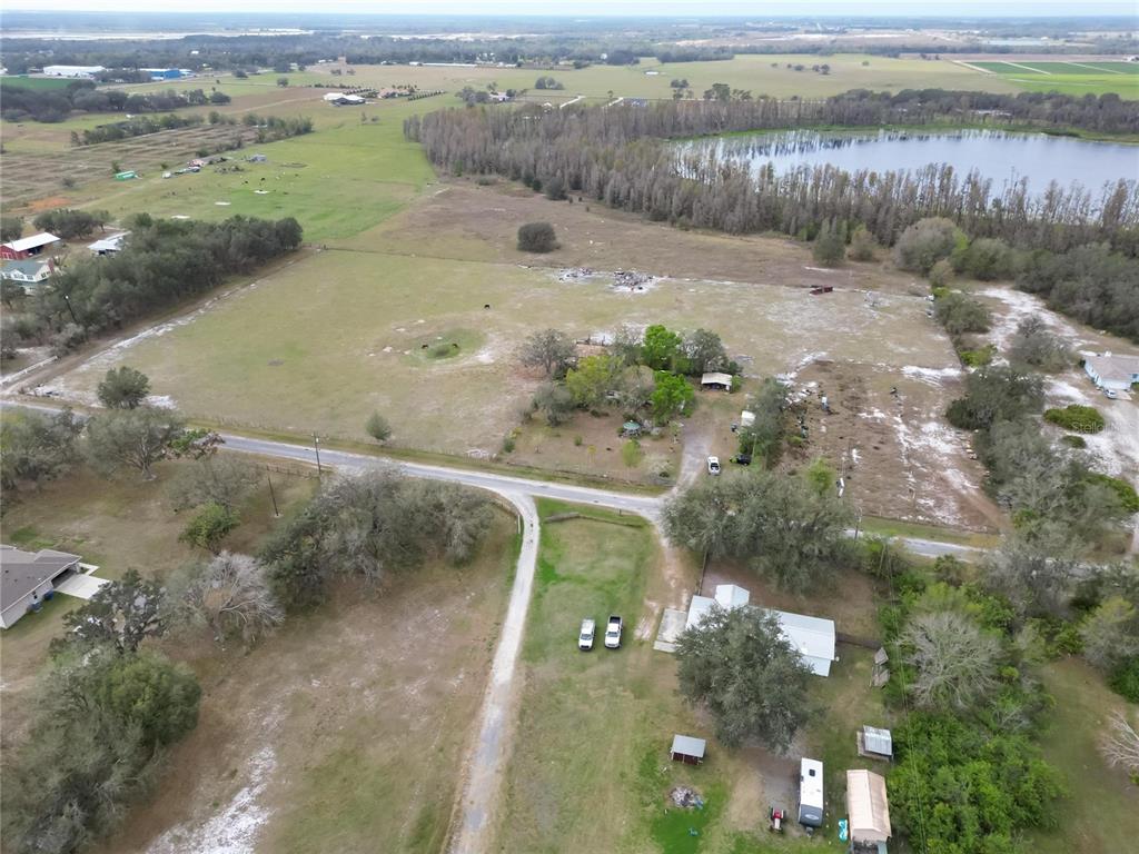 17273 Alderman Turner Road Wimauma, FL 33598 - Photo 17 of 60 an aerial view of a houses with a lake