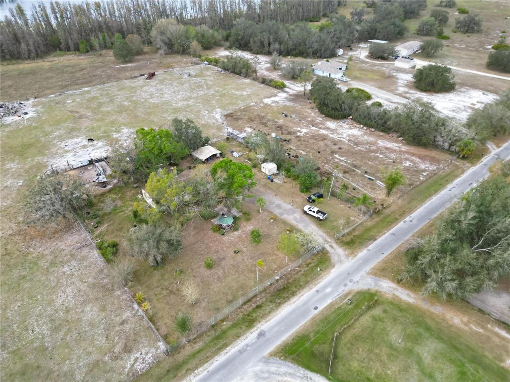 17273 Alderman Turner Road Wimauma, FL 33598 - Photo 18 of 60 a backyard of a house with a yard and outdoor seating
