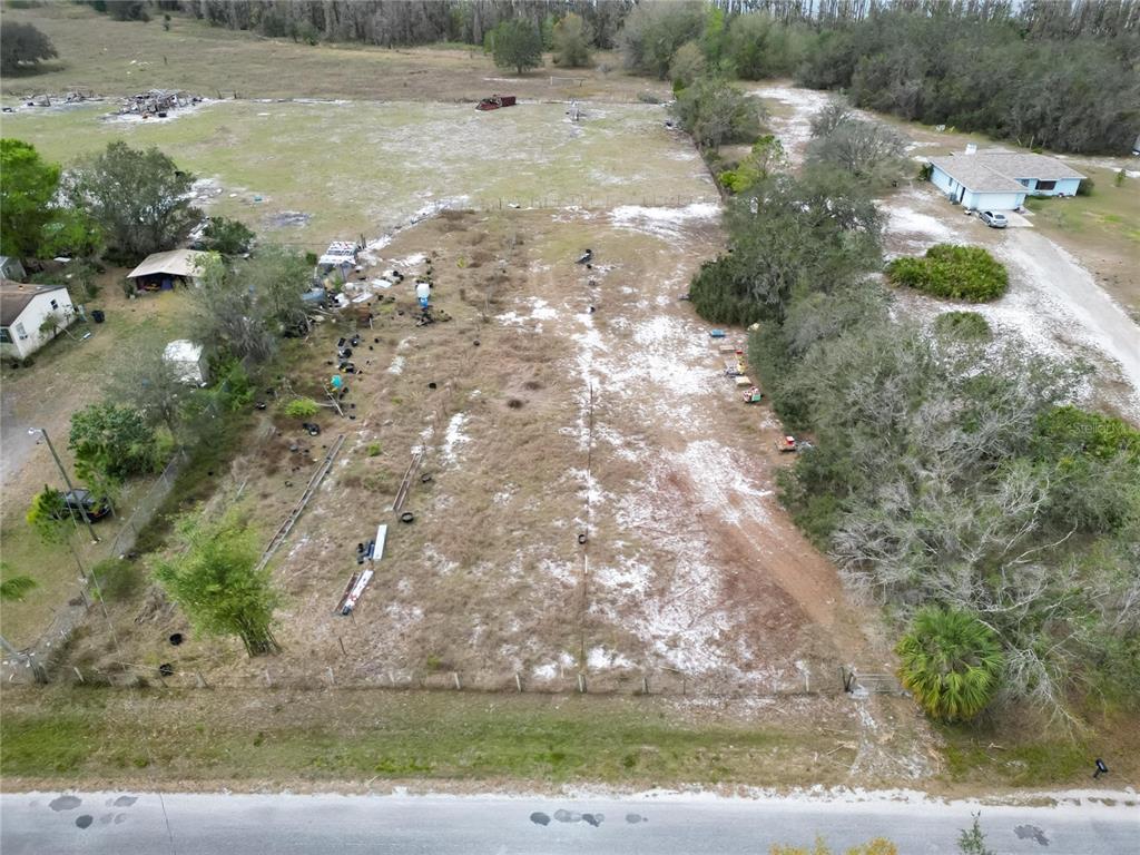 17273 Alderman Turner Road Wimauma, FL 33598 - Photo 30 of 60 a view of a yard with plants