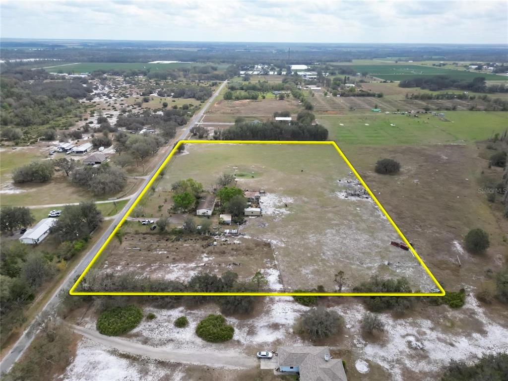 17273 Alderman Turner Road Wimauma, FL 33598 - Photo 32 of 60 an aerial view of residential houses with outdoor space