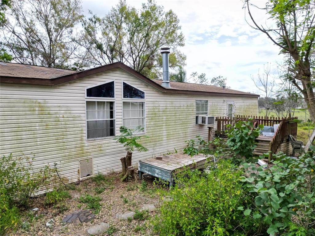 17273 Alderman Turner Road Wimauma, FL 33598 - Photo 38 of 60 a backyard of a house with table and chairs