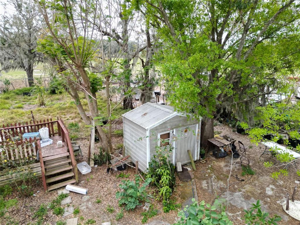 17273 Alderman Turner Road Wimauma, FL 33598 - Photo 39 of 60 a view of a patio with a yard