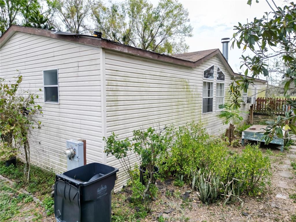 17273 Alderman Turner Road Wimauma, FL 33598 - Photo 40 of 60 a front view of a house with garden