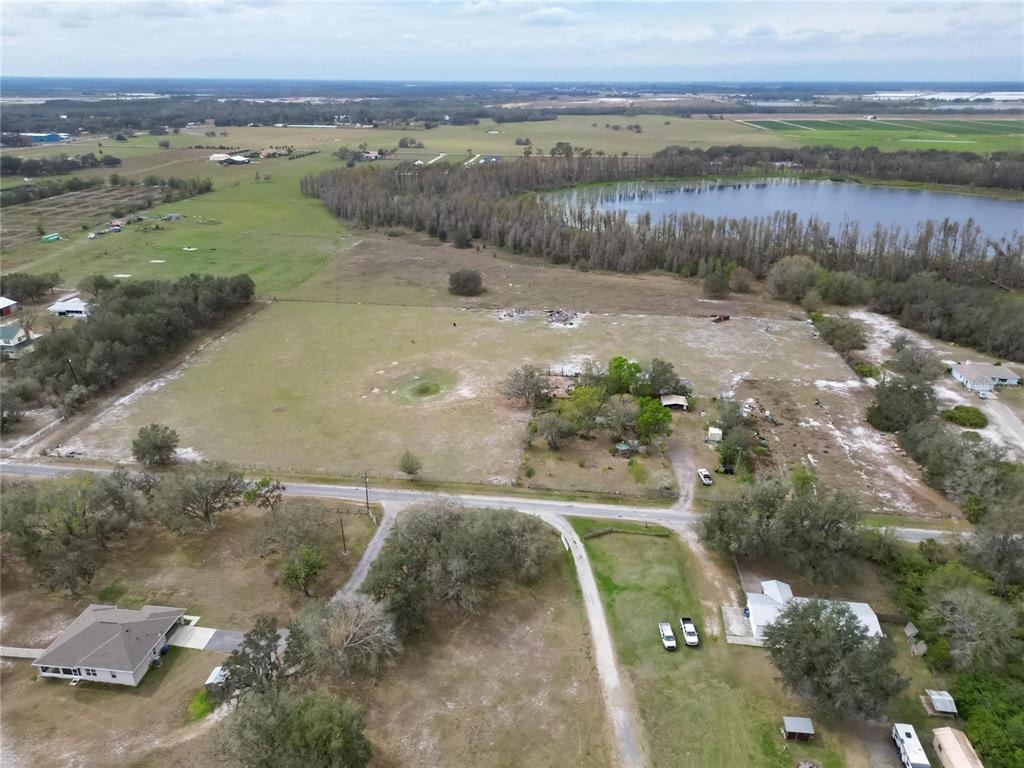 17273 Alderman Turner Road Wimauma, FL 33598 - Photo 4 of 60 a view of a lake with a mountain