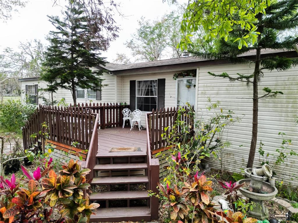 17273 Alderman Turner Road Wimauma, FL 33598 - Photo 42 of 60 a front view of a house with a porch