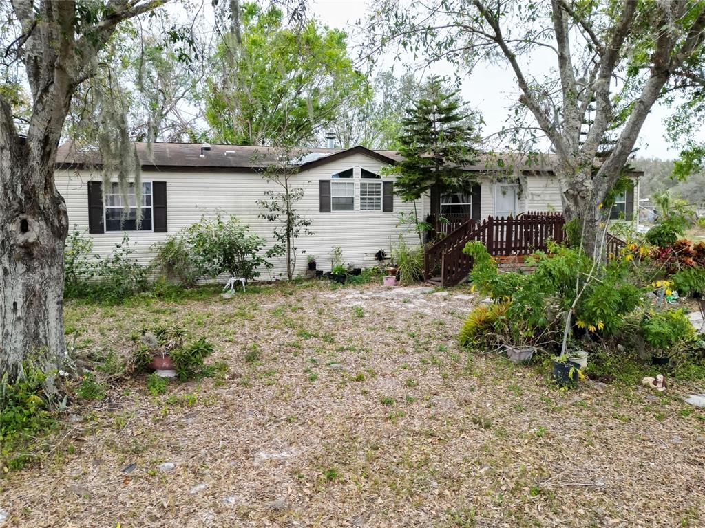 17273 Alderman Turner Road Wimauma, FL 33598 - Photo 44 of 60 a house view with a garden space