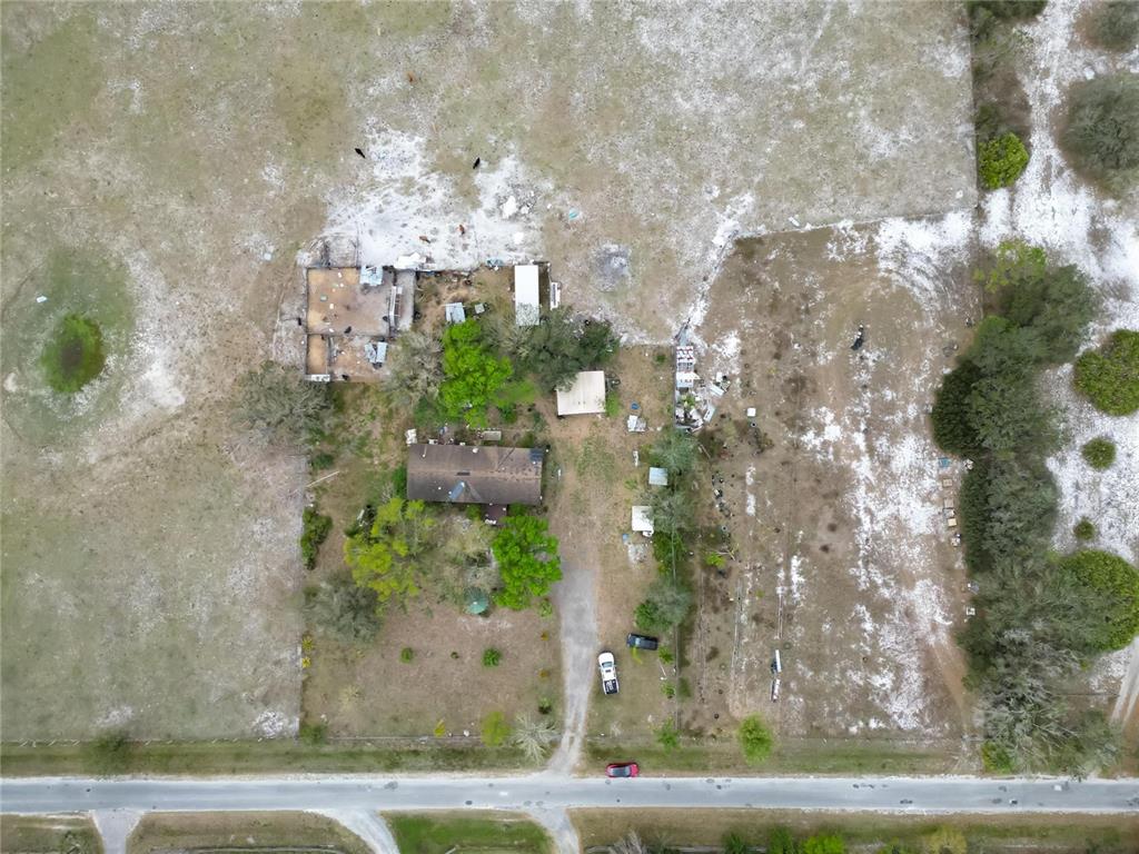 17273 Alderman Turner Road Wimauma, FL 33598 - Photo 51 of 60 a front view of a house with a yard