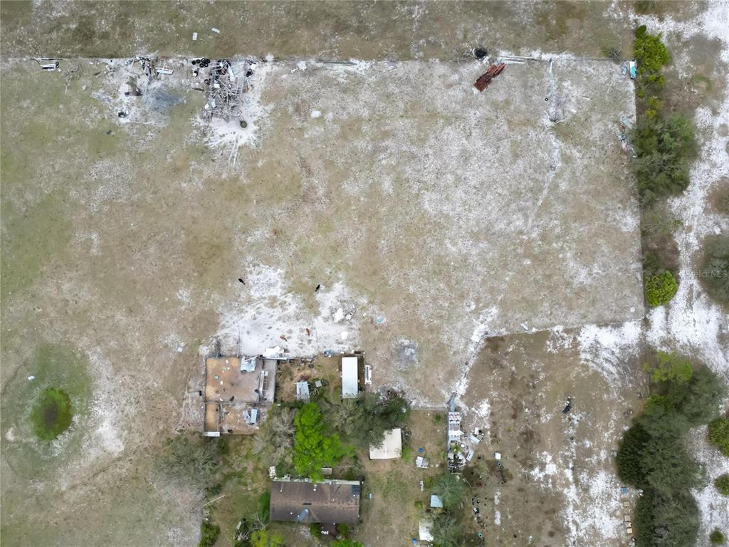 17273 Alderman Turner Road Wimauma, FL 33598 - Photo 52 of 60 a building with trees in front of it