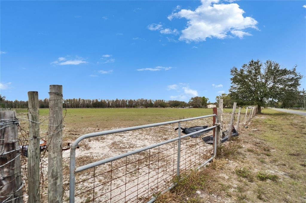 17273 Alderman Turner Road Wimauma, FL 33598 - Photo 59 of 60 a view of a lake with a terrace