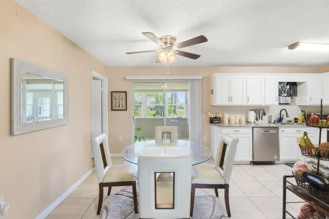 a view of a dining room with furniture and a window
