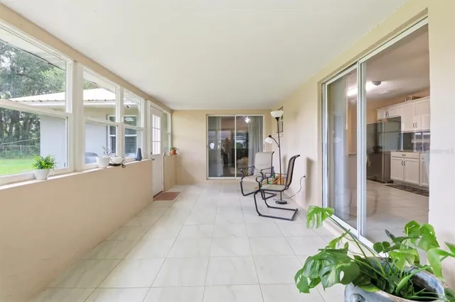 a view of a livingroom with furniture and a potted plant