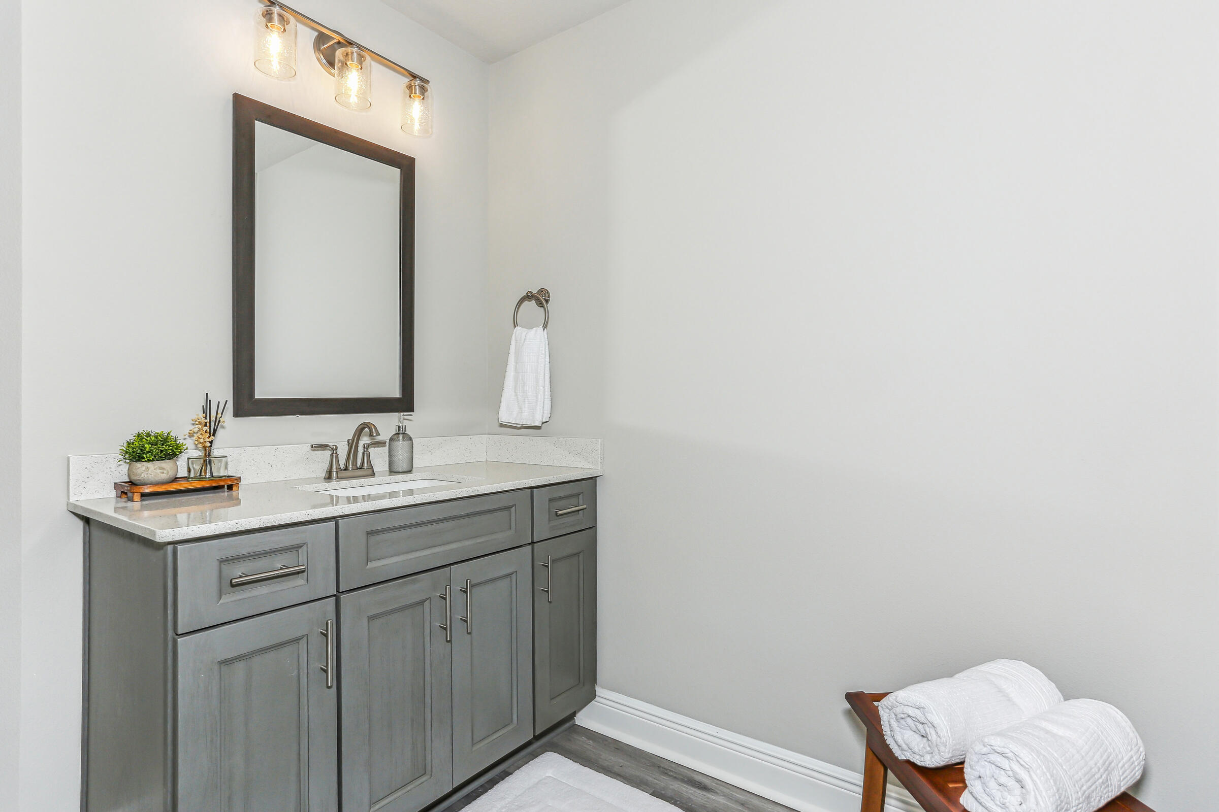 4851 Horace Lunsford Road Milton, FL 32570 - Photo 27 of 38 a bathroom with a toilet sink vanity and mirror