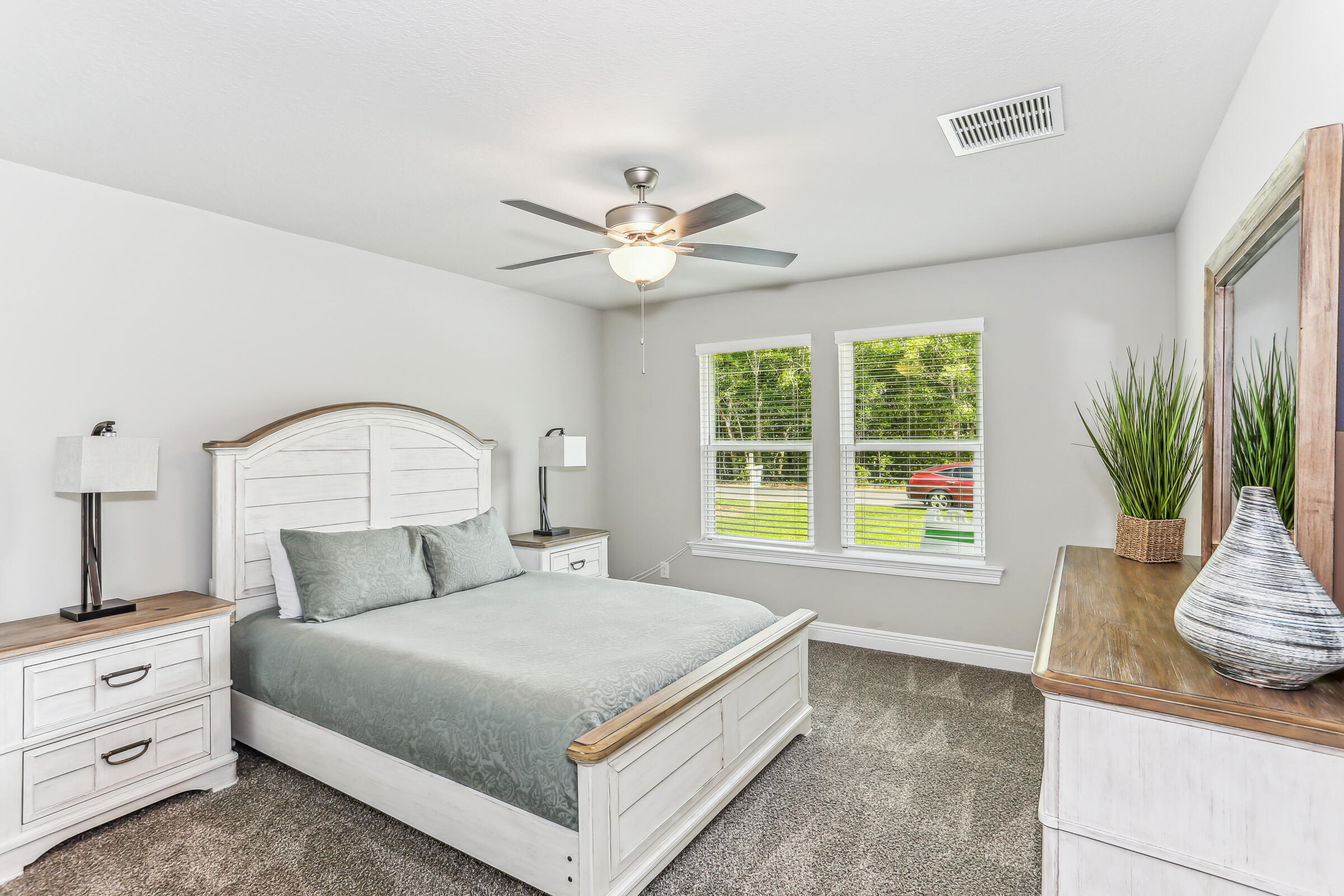 4851 Horace Lunsford Road Milton, FL 32570 - Photo 30 of 38 a bedroom with a large bed and a large window
