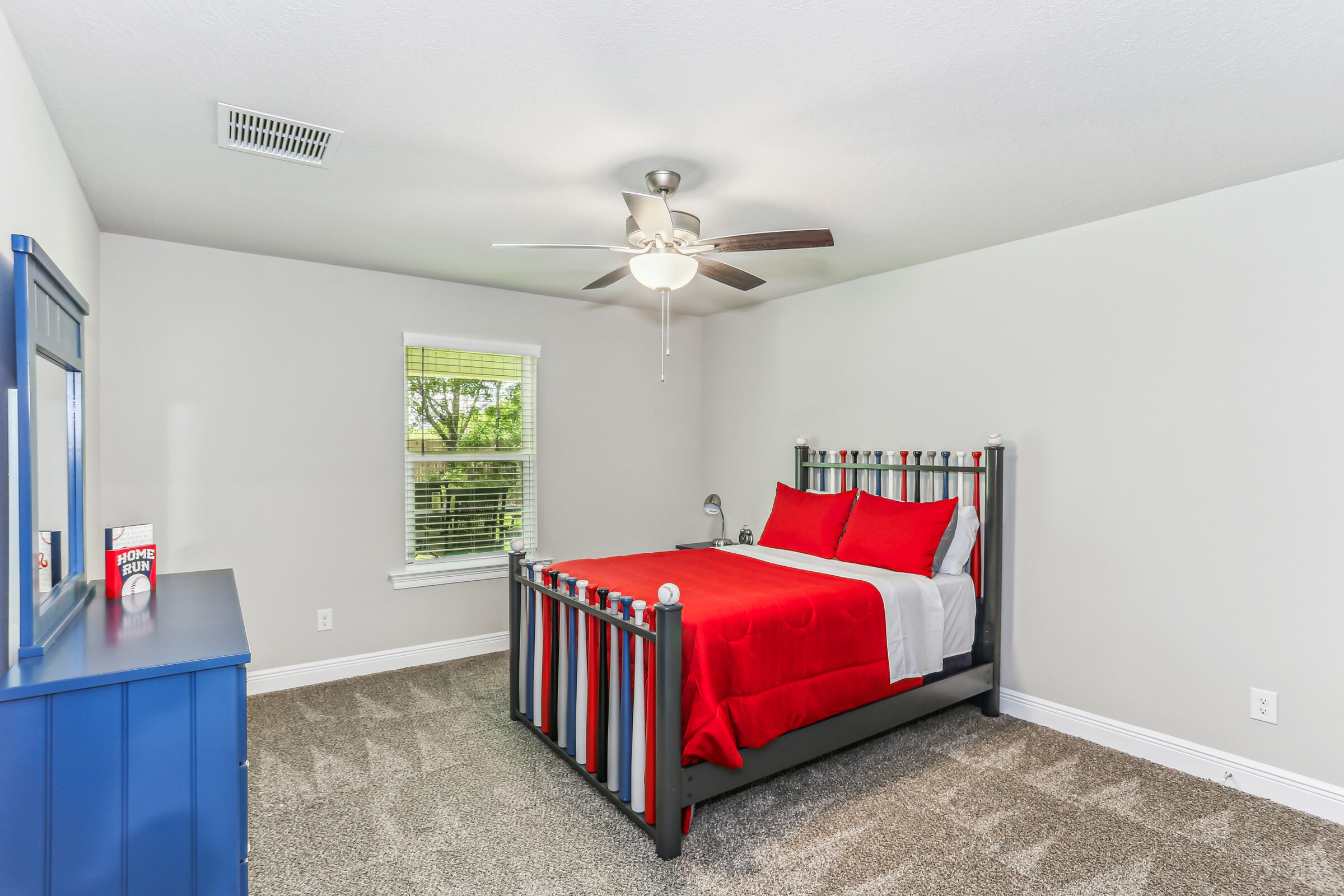 4851 Horace Lunsford Road Milton, FL 32570 - Photo 32 of 38 a bedroom with a bed and a chandelier