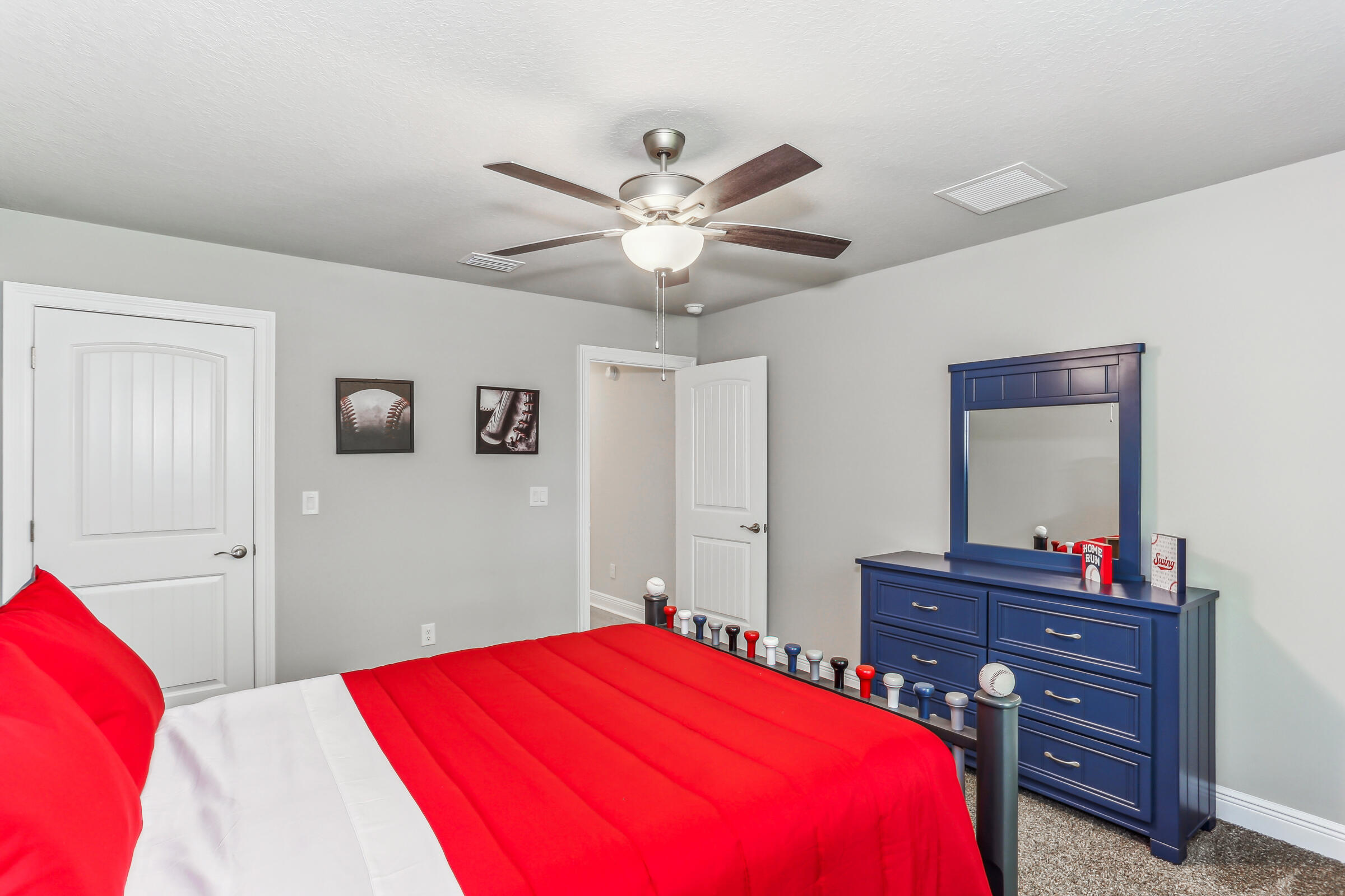 4851 Horace Lunsford Road Milton, FL 32570 - Photo 33 of 38 a bedroom with a bed and a dresser