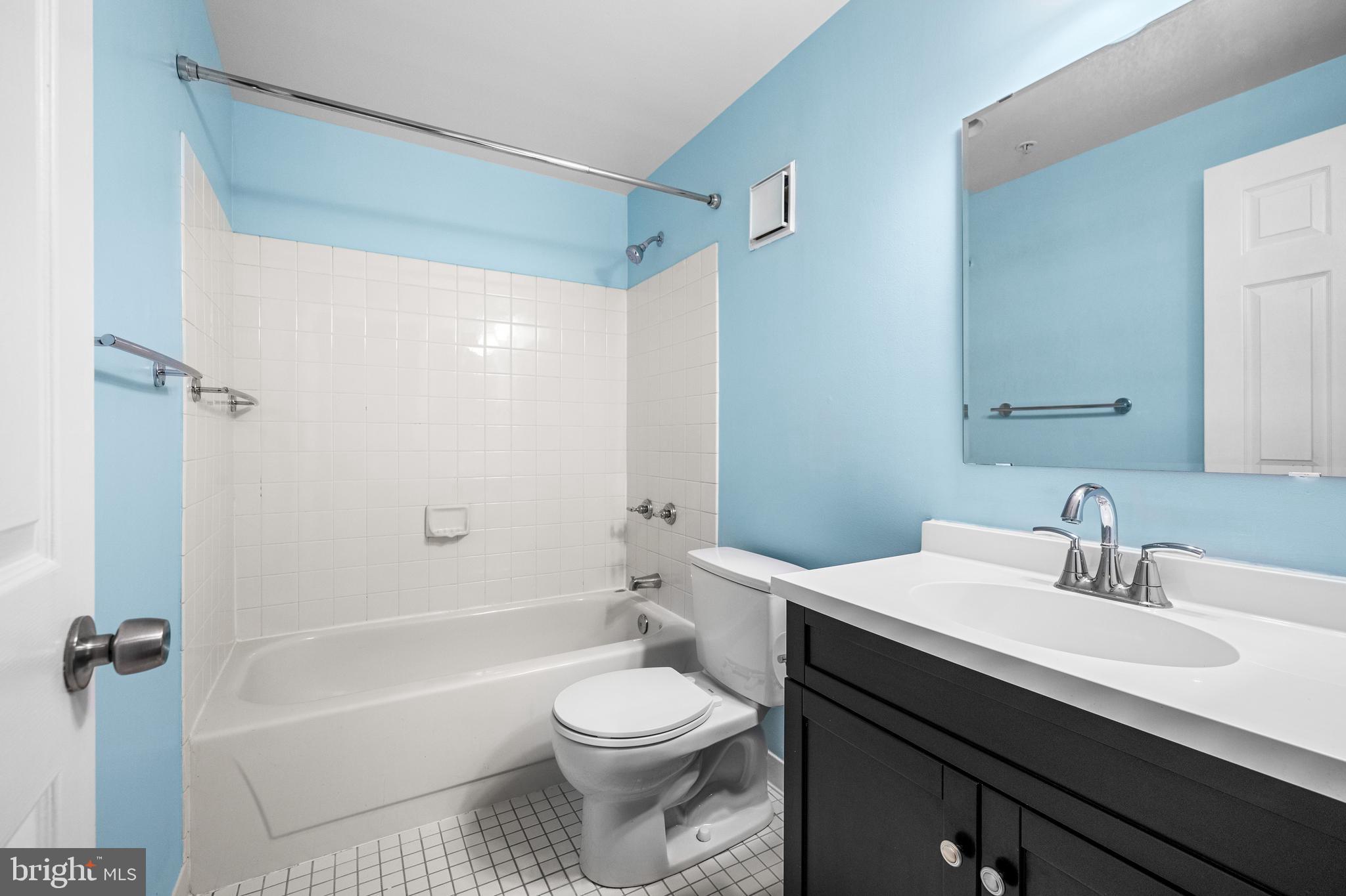 1000 Fell Street, Unit 421 Baltimore, MD 21231 - Photo 13 of 32 a bathroom with a sink a toilet and shower