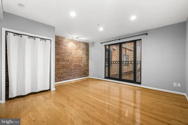 a view of an empty room with a window