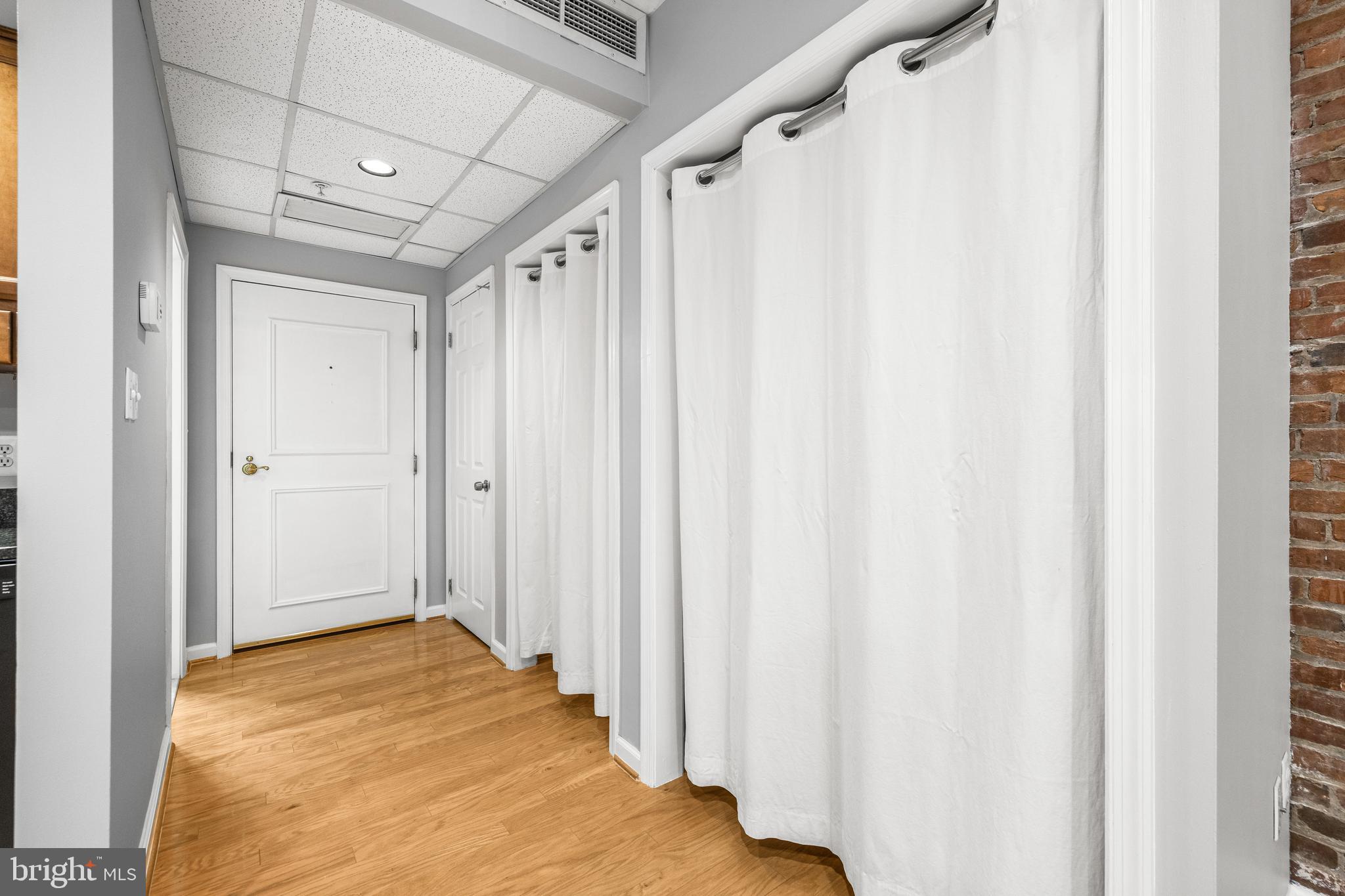 1000 Fell Street, Unit 421 Baltimore, MD 21231 - Photo 23 of 32 a view of a big room with wooden floor and staircase