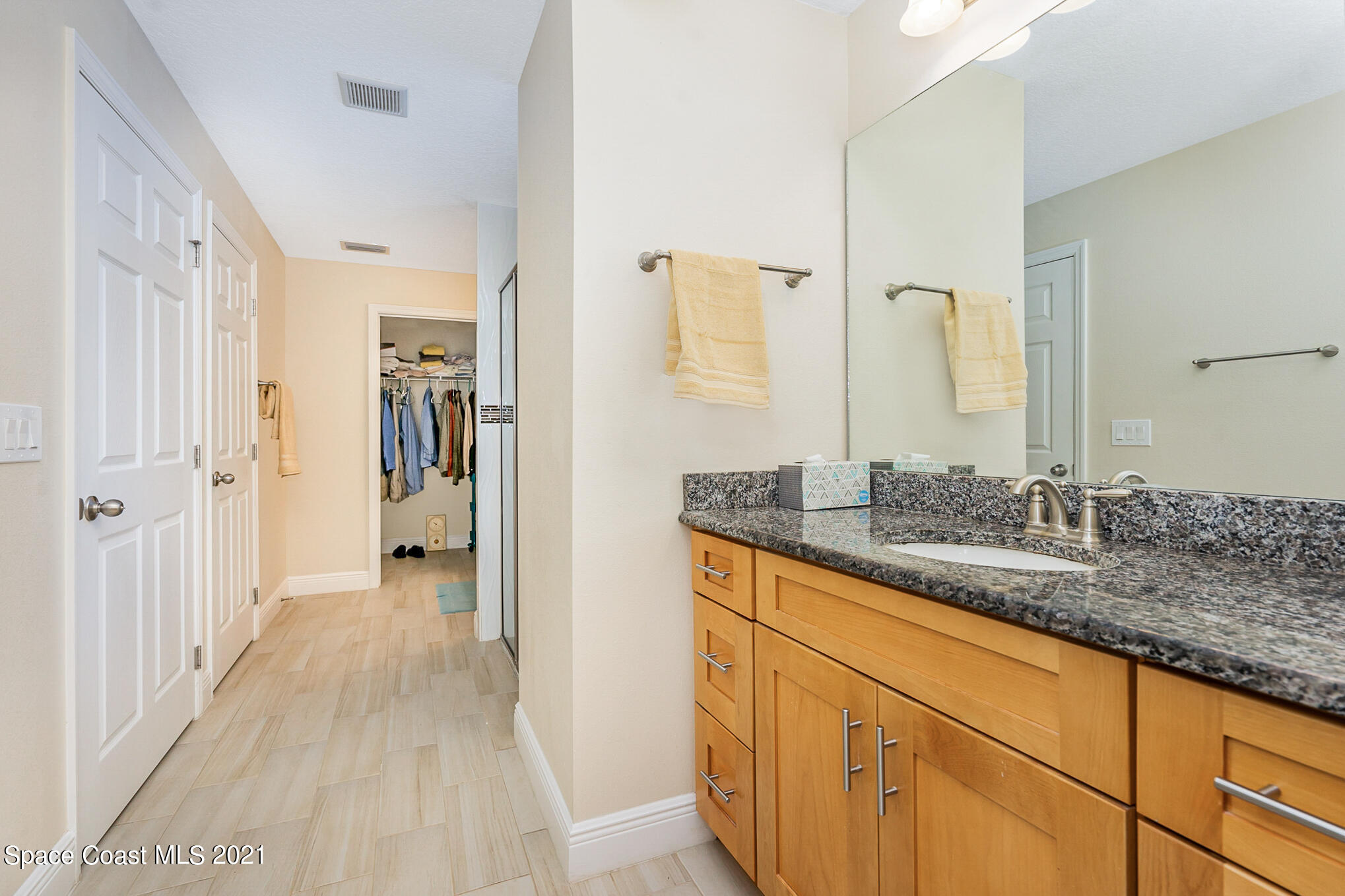 5576 Flint Road Cocoa, FL 32927 - Photo 16 of 31 a bathroom with a sink and a mirror