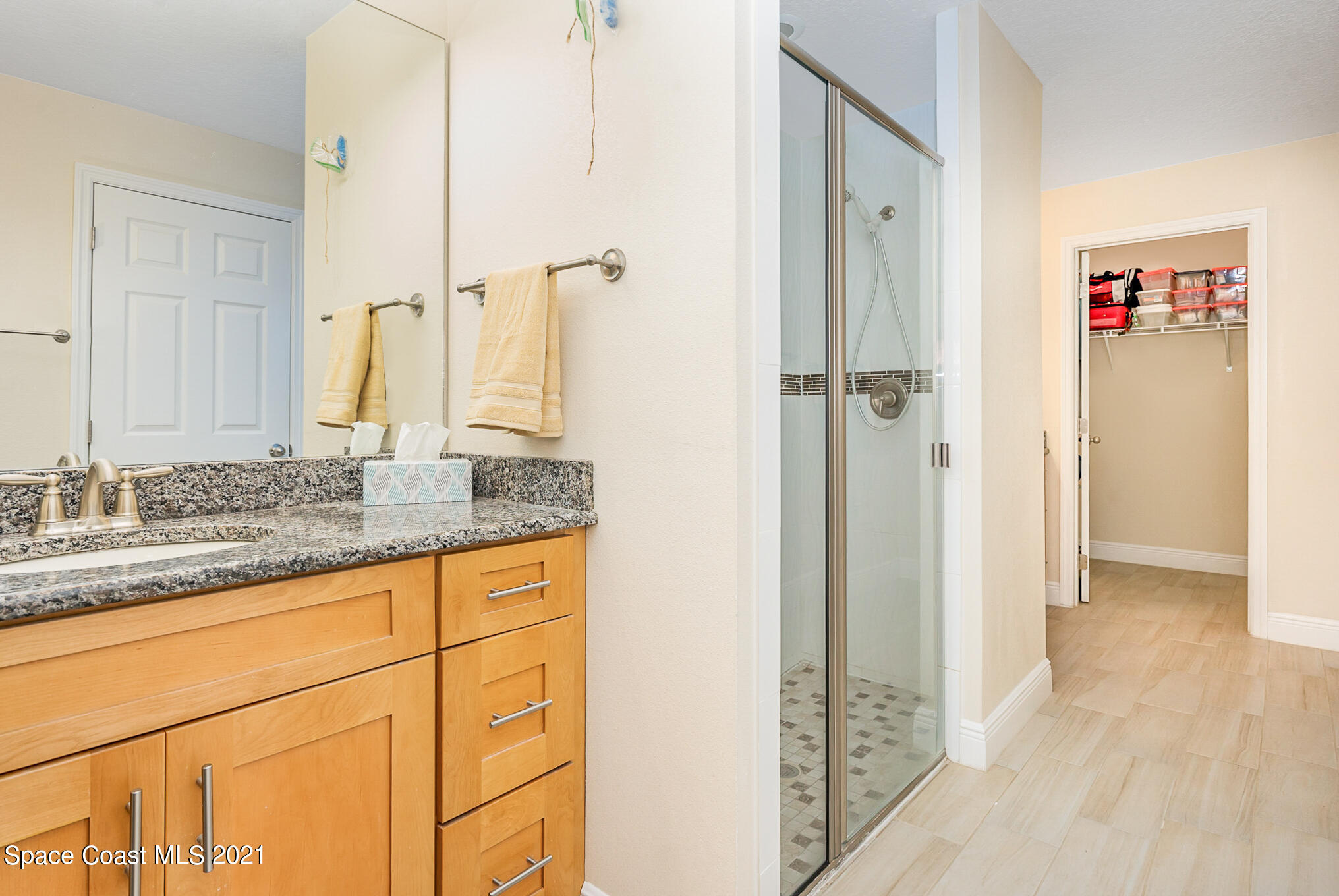 5576 Flint Road Cocoa, FL 32927 - Photo 18 of 31 a bathroom with a granite countertop sink and a mirror