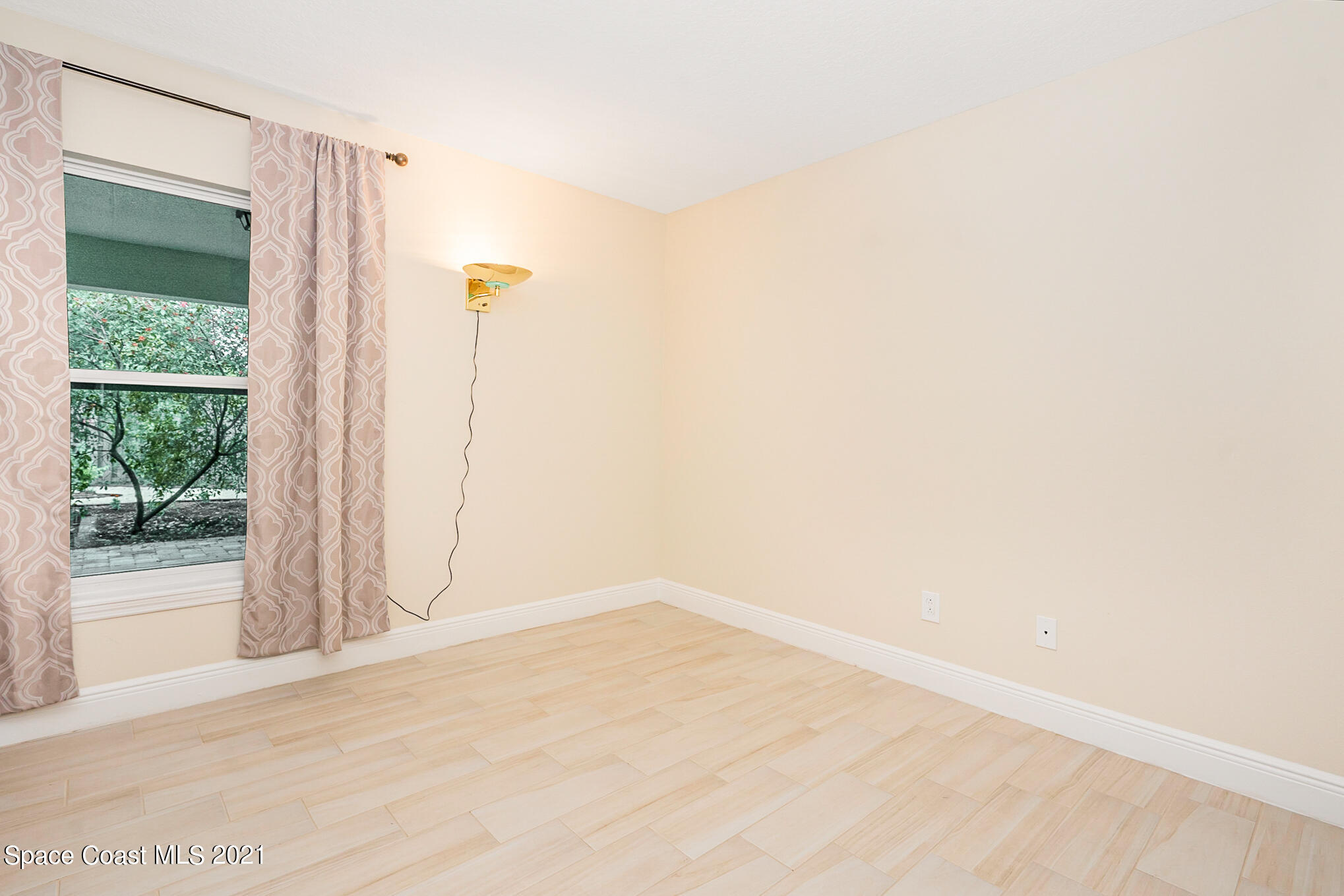 5576 Flint Road Cocoa, FL 32927 - Photo 19 of 31 a view of empty room with floor to ceiling window