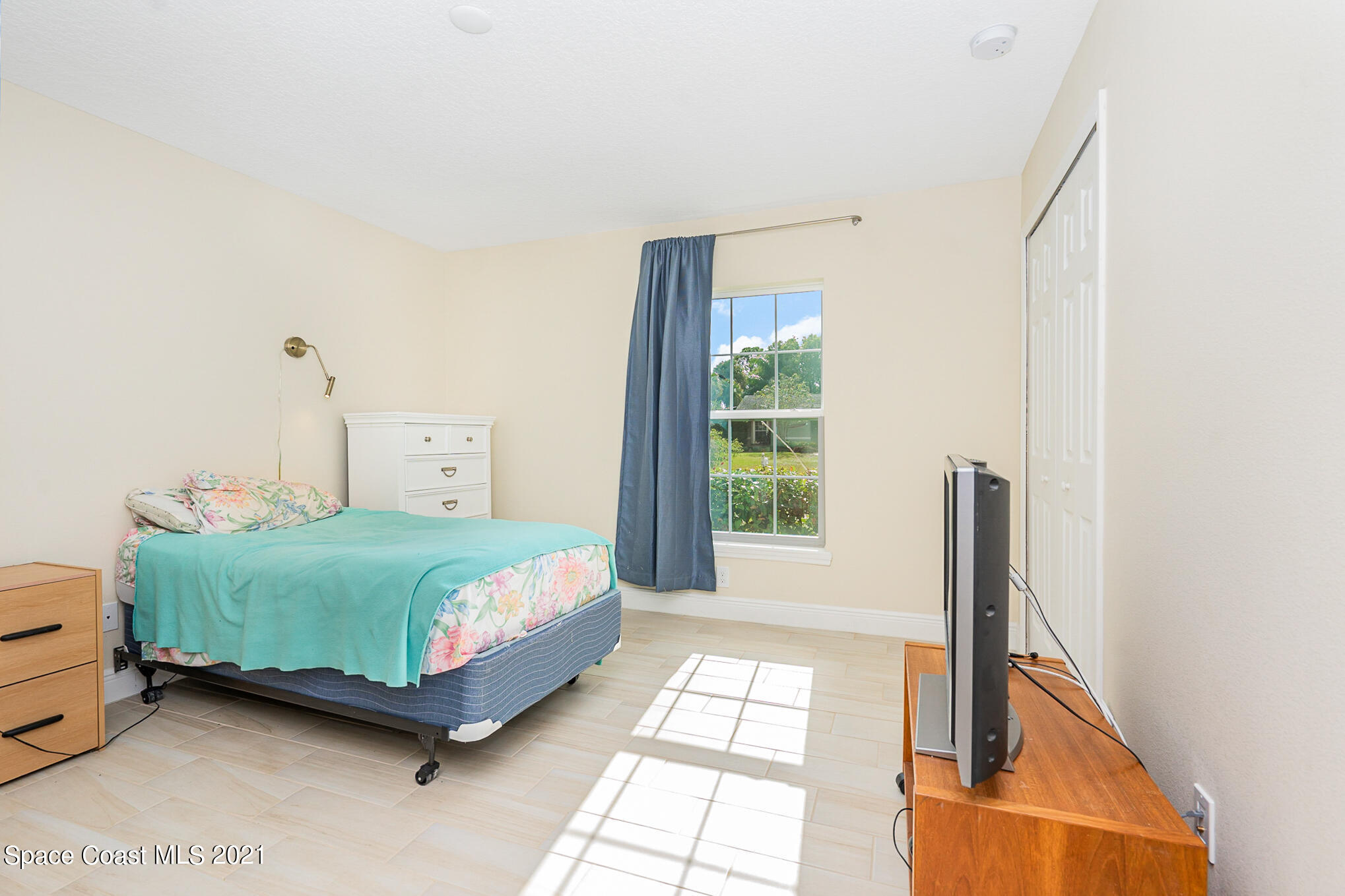 5576 Flint Road Cocoa, FL 32927 - Photo 20 of 31 a bedroom with a bed and a window
