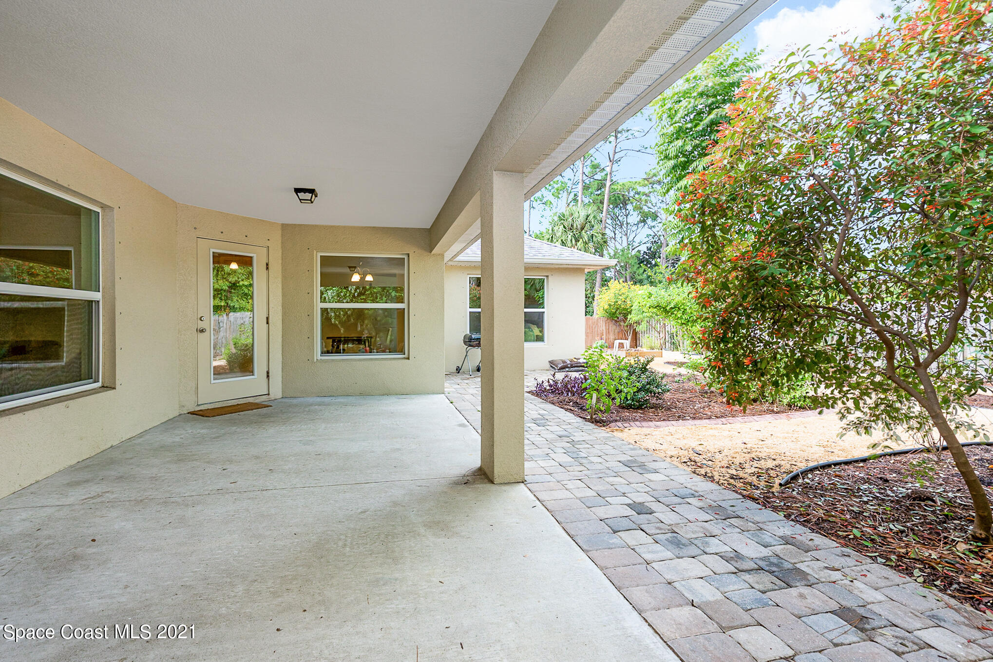 5576 Flint Road Cocoa, FL 32927 - Photo 26 of 31 a view of a house with backyard and garden