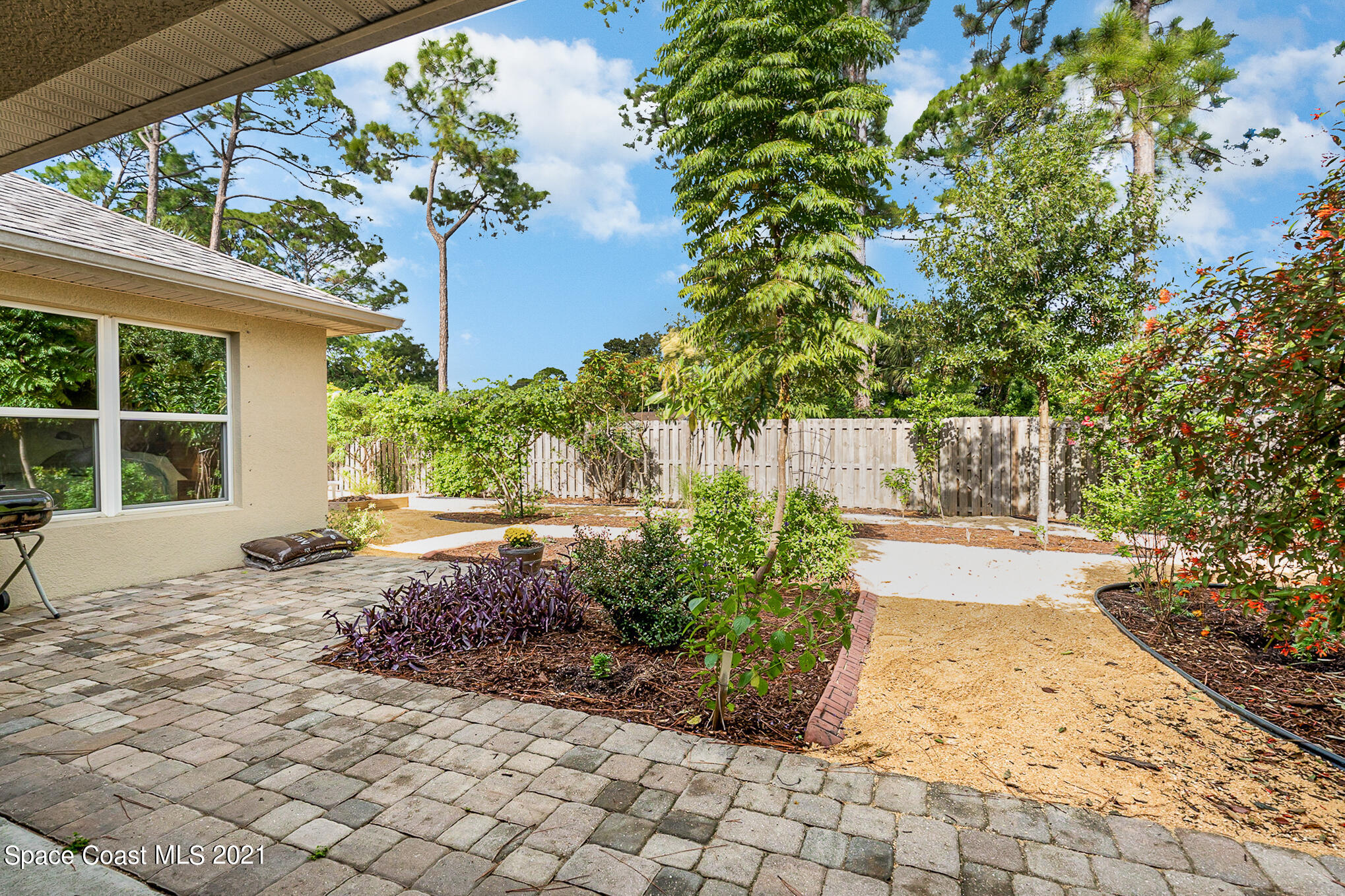 5576 Flint Road Cocoa, FL 32927 - Photo 27 of 31 a view of a backyard with garden