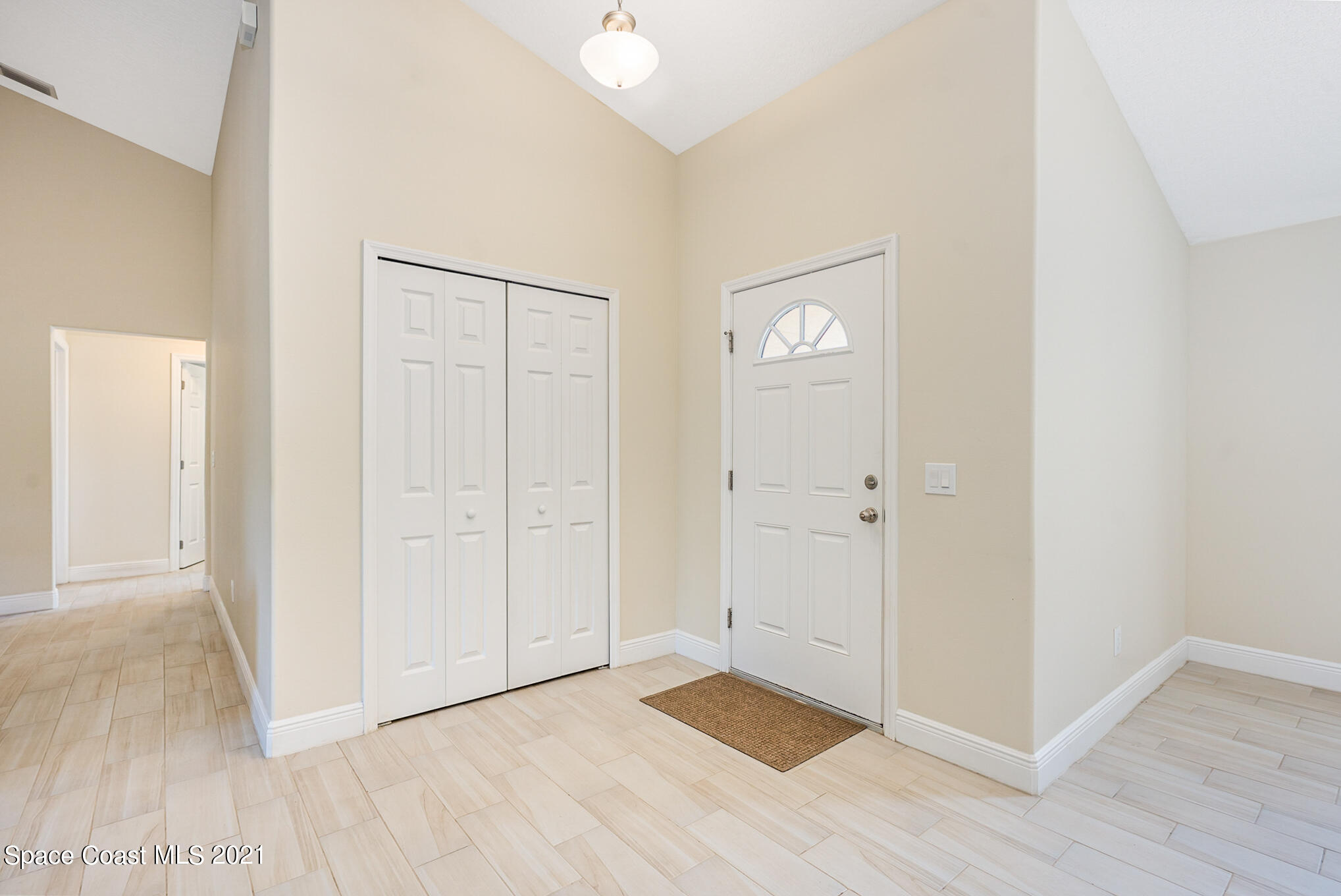 5576 Flint Road Cocoa, FL 32927 - Photo 3 of 31 a view of an empty room with wooden floor