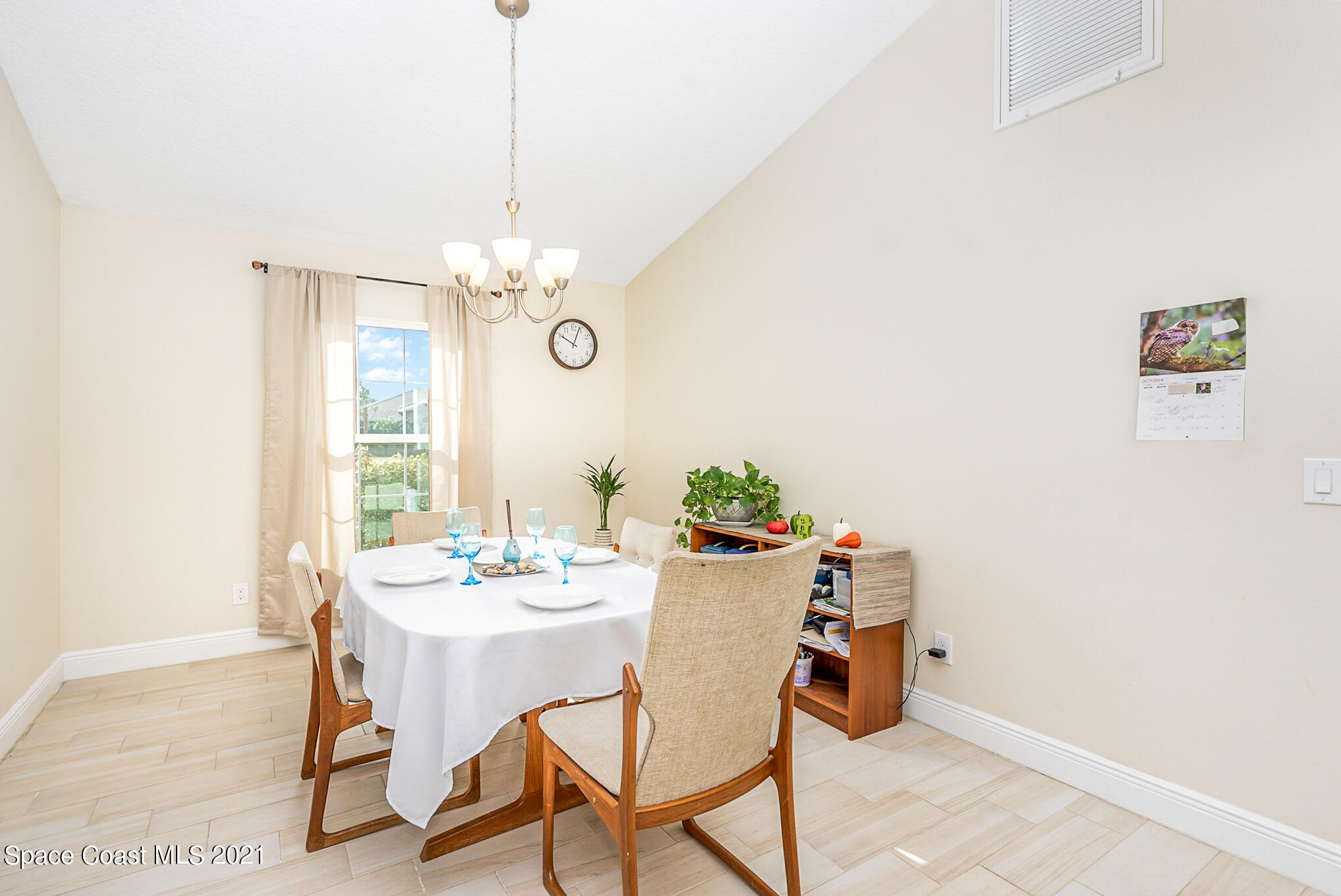 5576 Flint Road Cocoa, FL 32927 - Photo 4 of 31 a dining room with a table and chairs