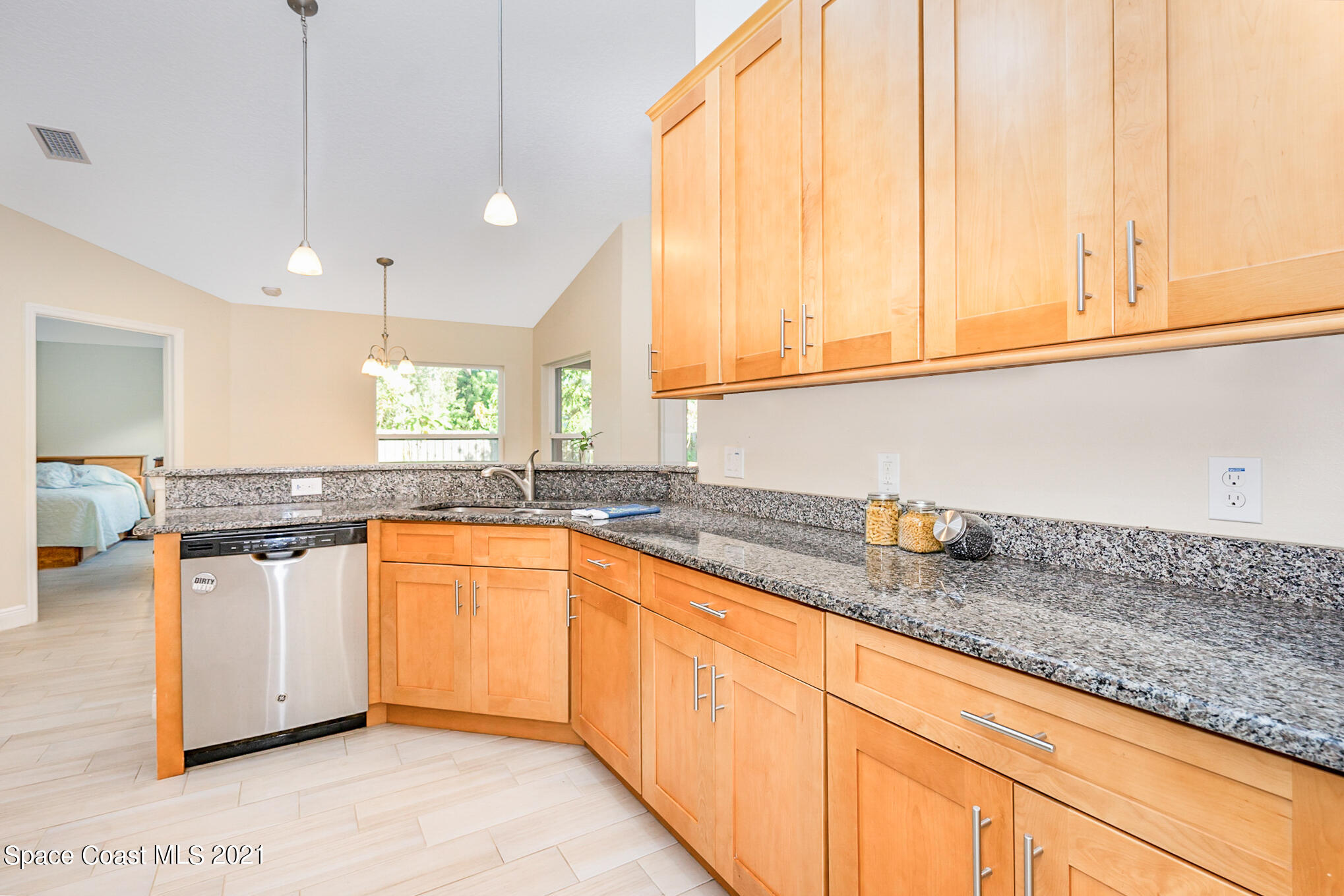 5576 Flint Road Cocoa, FL 32927 - Photo 5 of 31 a kitchen with stainless steel appliances granite countertop a sink a stove and a window