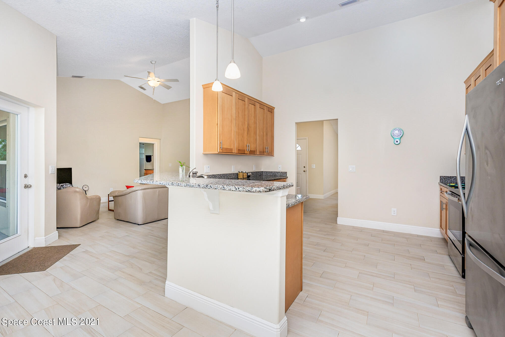 5576 Flint Road Cocoa, FL 32927 - Photo 7 of 31 a kitchen with stainless steel appliances a refrigerator and a stove