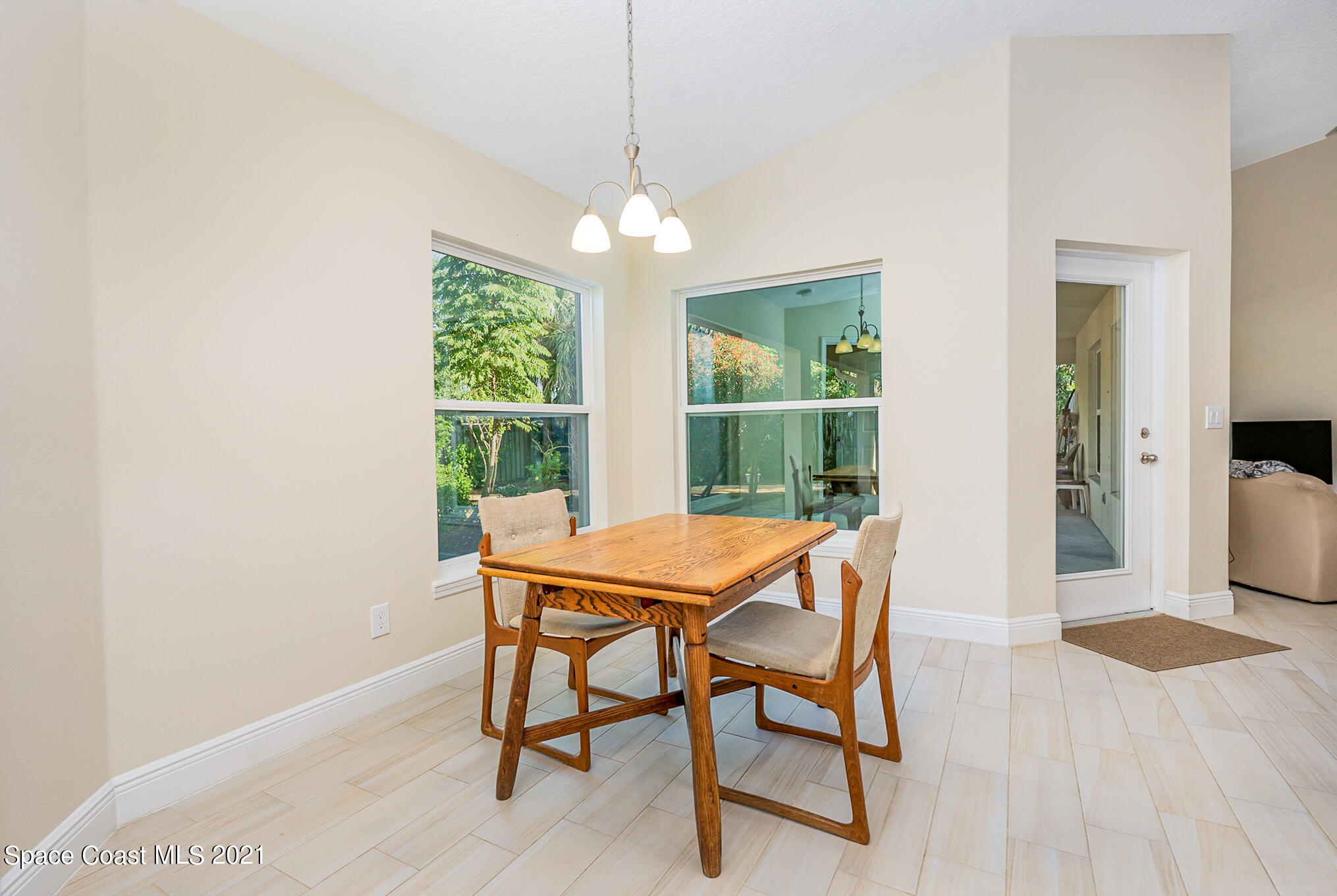 5576 Flint Road Cocoa, FL 32927 - Photo 9 of 31 a dining room with furniture and window