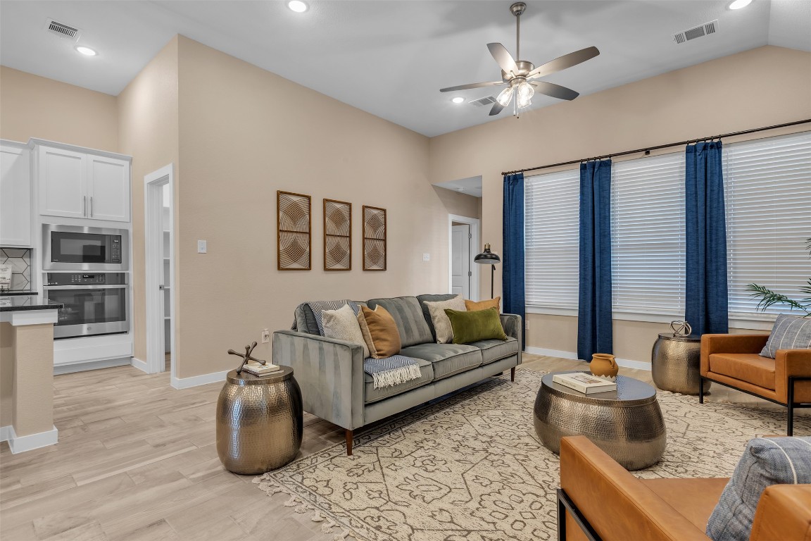153 Billowing Way Kyle, TX 78640 - Photo 15 of 22 a living room with furniture and a chandelier
