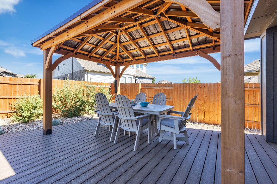 153 Billowing Way Kyle, TX 78640 - Photo 21 of 22 a view of a deck with wooden floor and outdoor seating