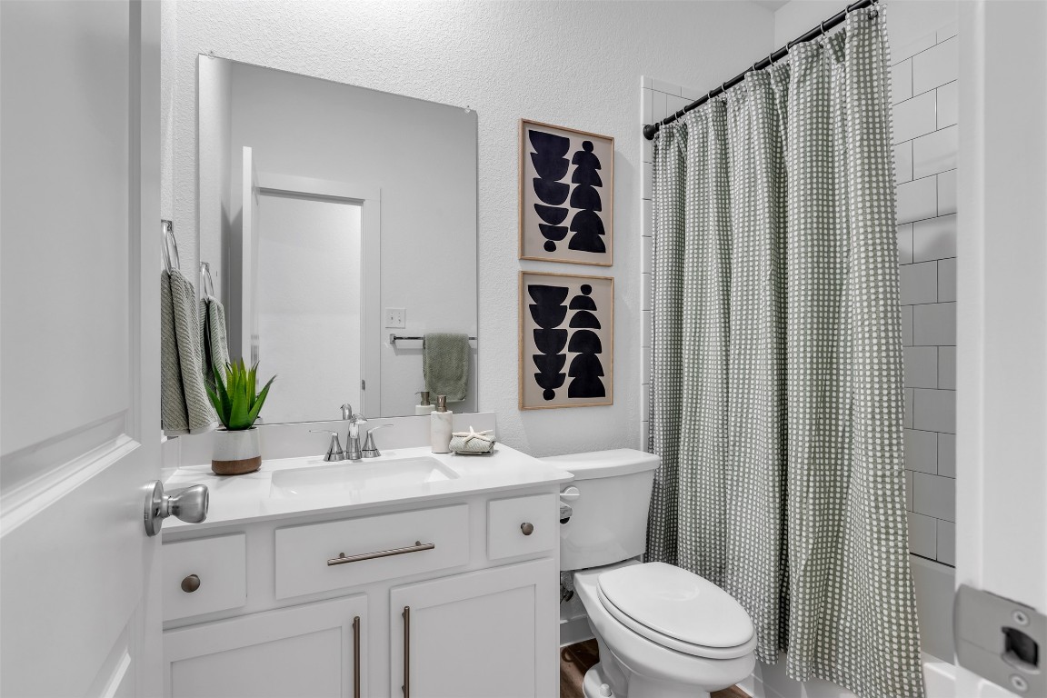 153 Billowing Way Kyle, TX 78640 - Photo 9 of 22 a bathroom with a sink a toilet and shower