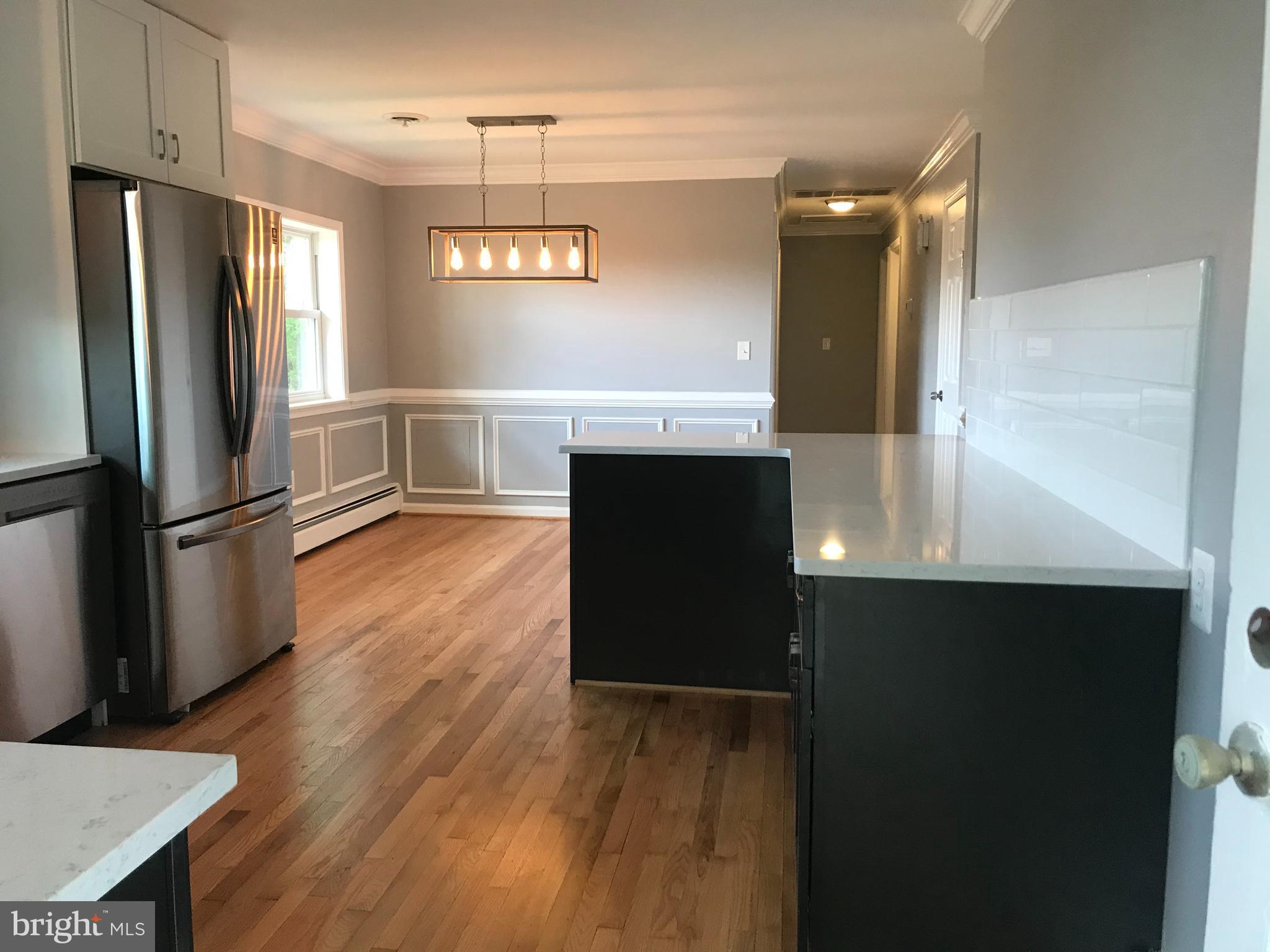 18600 Jerusalem Church Road Poolesville, MD 20837 - Photo 4 of 12 a kitchen with stainless steel appliances a refrigerator and a stove