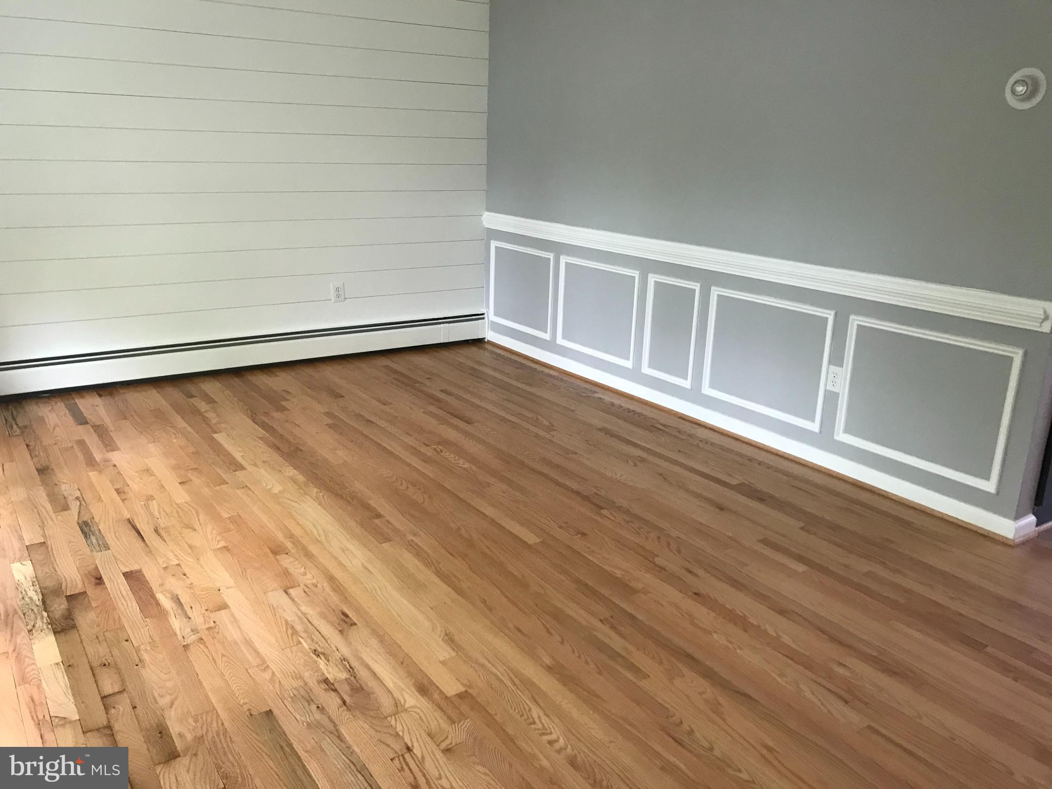 18600 Jerusalem Church Road Poolesville, MD 20837 - Photo 7 of 12 a view of an empty room with wooden floor and a window
