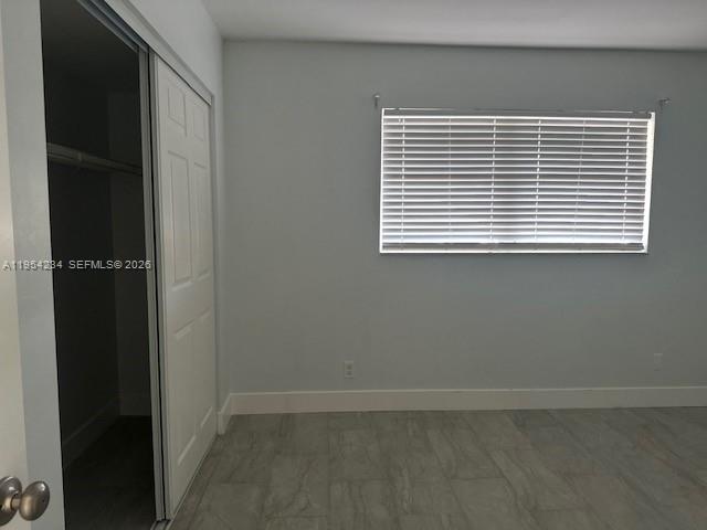 3905 North Nob Hill Road, Unit 304 Sunrise, FL 33351 - Photo 12 of 17 an empty room with a window