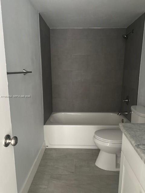 3905 North Nob Hill Road, Unit 304 Sunrise, FL 33351 - Photo 14 of 17 a bathroom with a toilet a sink and bathtub